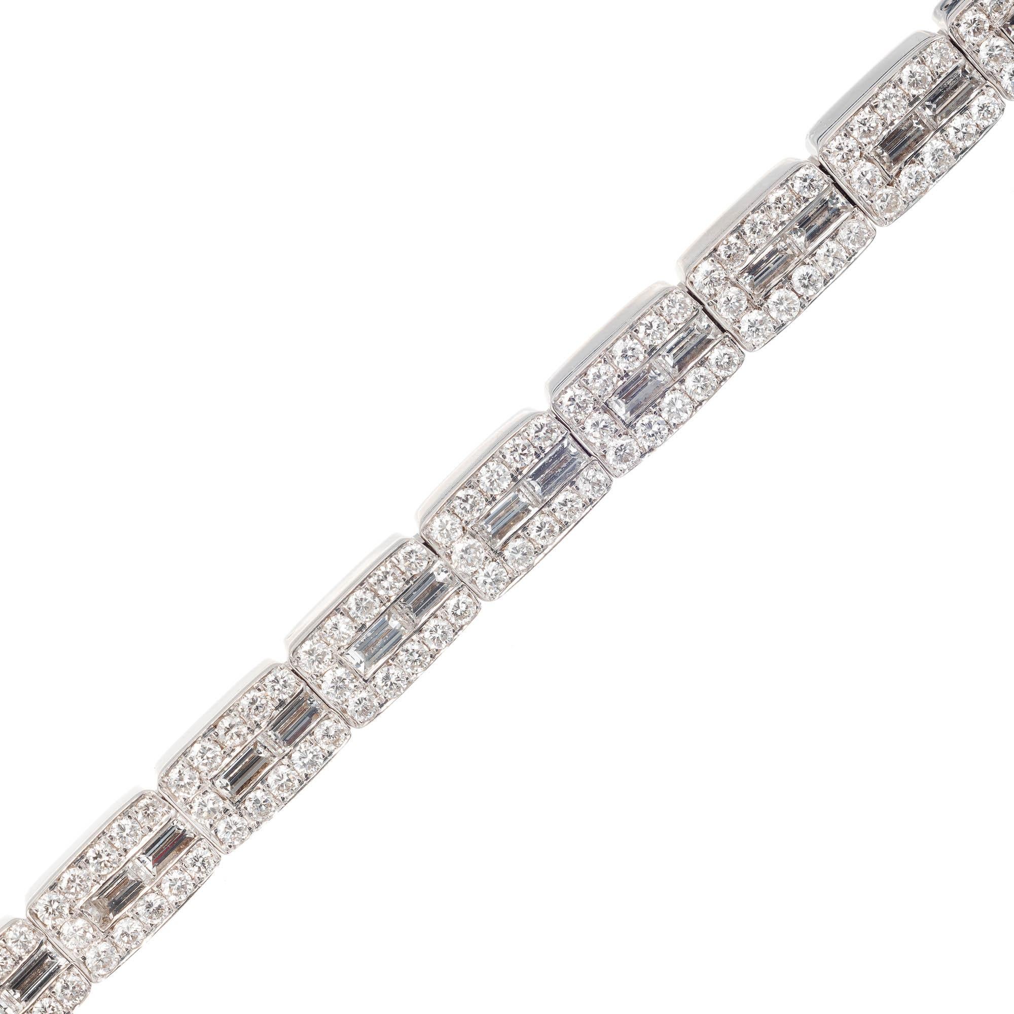 Solid 18k white gold diamond bracelet. Rectangular link bracelet bead and channel set with 2 outside rows of round Diamonds and a center row of Baguette Diamonds.  4.25cts total of F-G, VS Diamonds. Build in hidden catch and secure underside