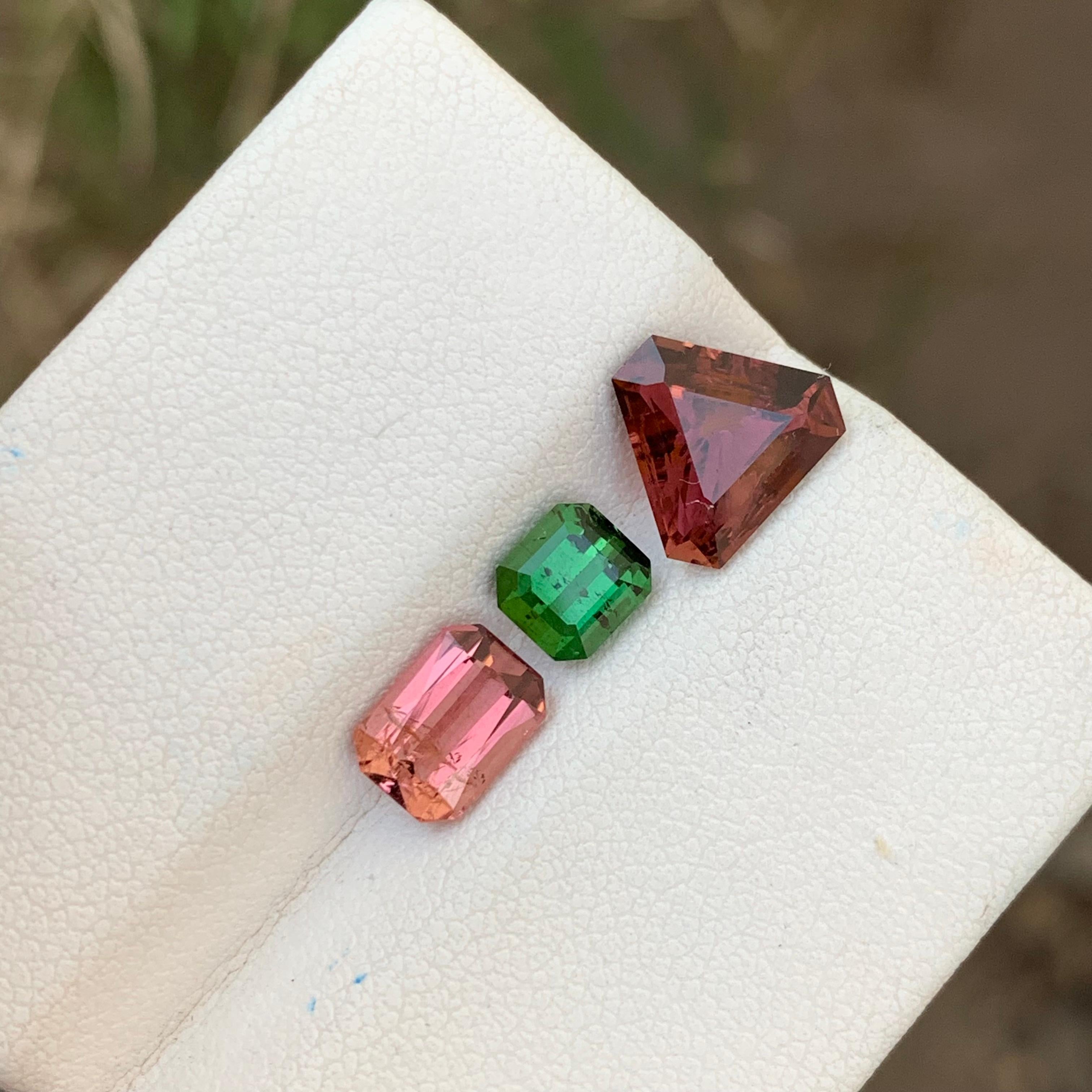 Loose Tourmaline 
Weight: 4.25 Carats 
Size: 1.85 , 1.35 , 0.95 Carats 
Origin: Kunar Afghanistan 
Shape: Emerald, Trillion, Cushion
Treatment: Non
Color: Pink , Green & Red
Tourmaline, a captivating gemstone known for its stunning range of colors,