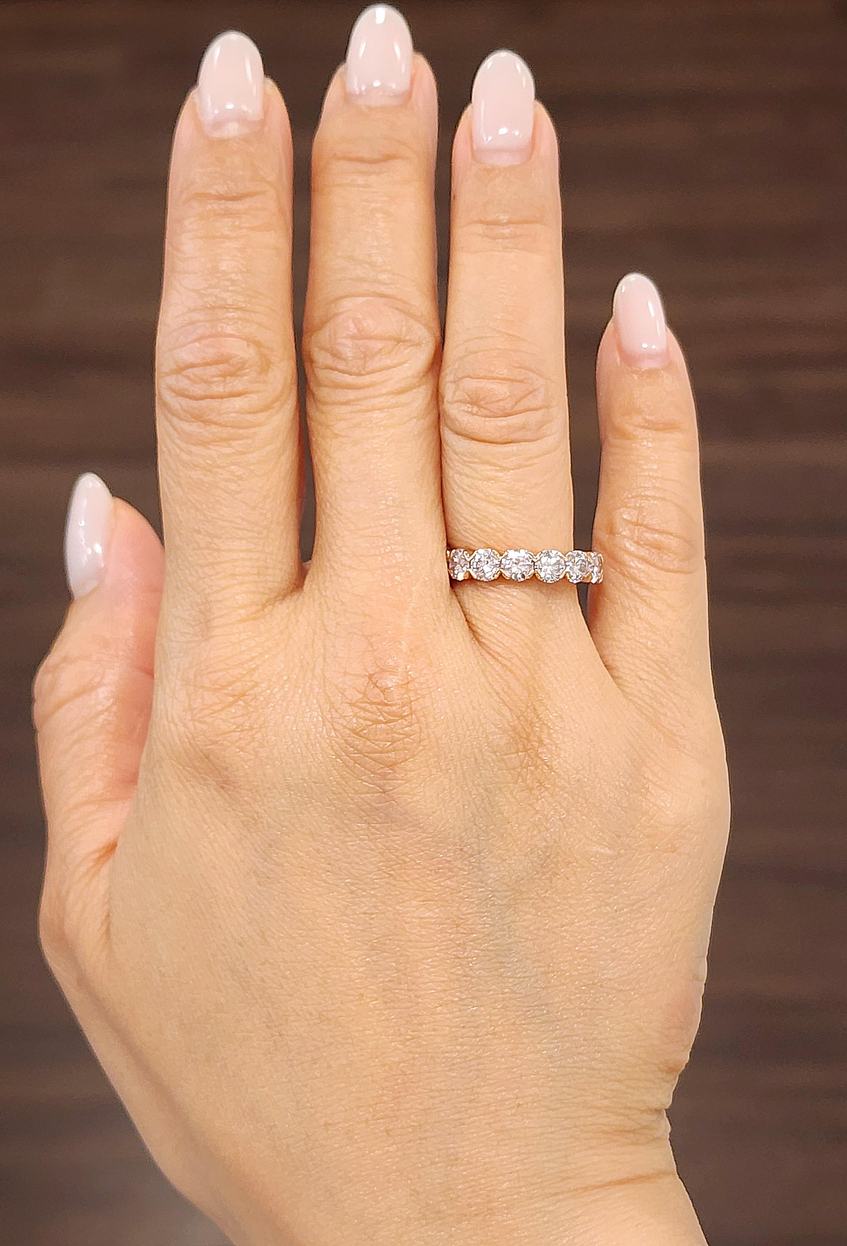 This exquisite band ring showcases a stunning array of 16 pink diamonds. The 4.25 ct round diamonds are set in a 14k rose gold band, creating a captivating display. The diamonds, with an I1 clarity, offer a unique charm. Crafted in 2023 in the