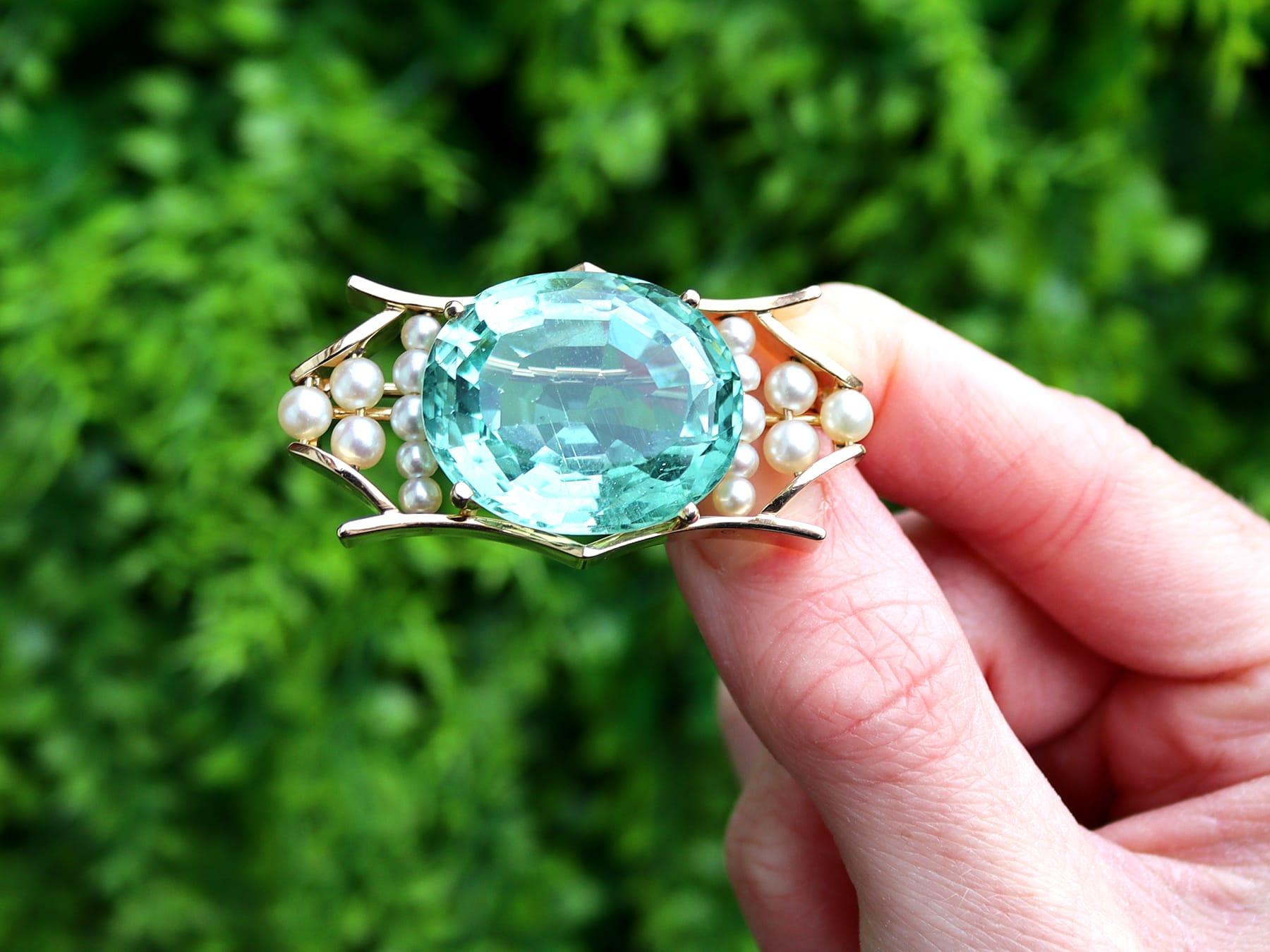 A stunning, fine and impressive antique 42.50 carat aquamarine and pearl, 18 karat yellow gold birks brooch; part of our diverse collection of antique aquamarine brooches.

This stunning, fine and impressive antique aquamarine brooch has been