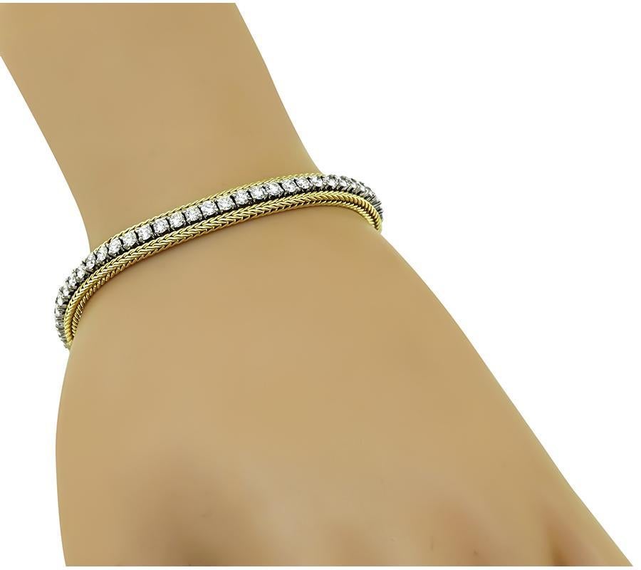 This is a charming 14k yellow and white gold bracelet. The bracelet is set with sparkling round cut diamonds that weigh approximately 4.25ct. The color of these diamonds is G-H with VS clarity. The bracelet measures 7 1/4 inches in length and 6mm in