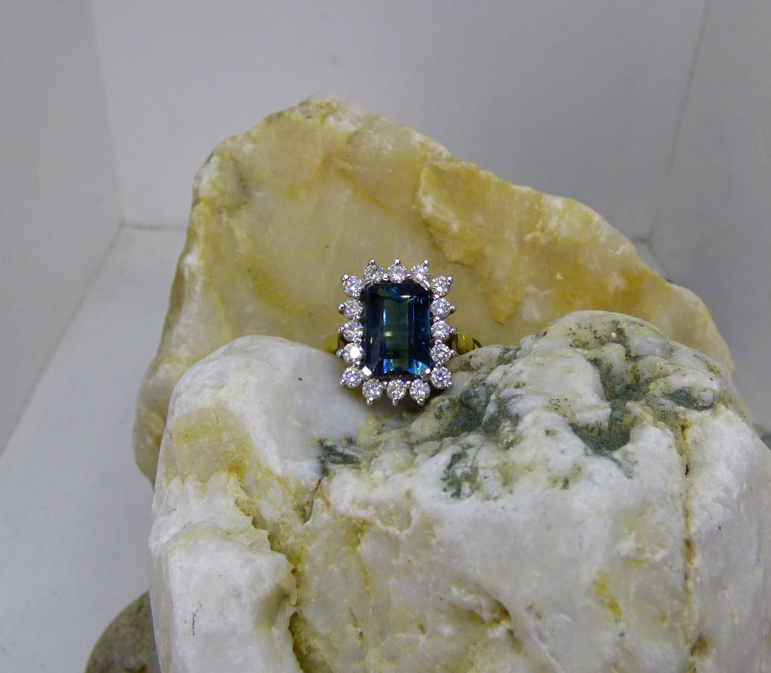 4.25ct. Step Cut  Indicolite and Diamond Cluster Ring in 18K gold