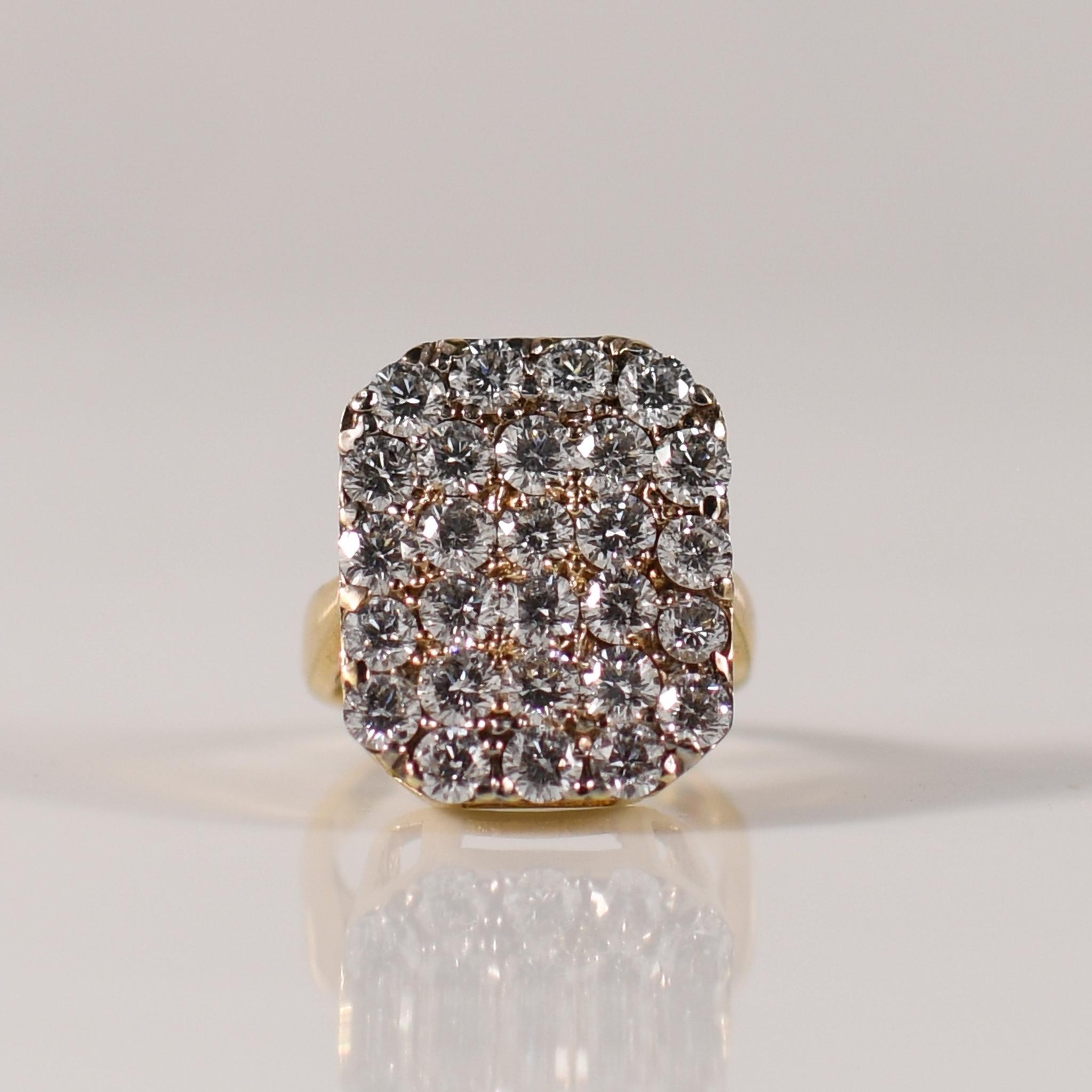 Step into the allure of bygone eras with this vintage-inspired pave diamond ring, boasting a total of 4.25 carats of shimmering brilliance. The diamonds, expertly set in a pave style, create a seamless blanket of sparkle, evoking the glamour of