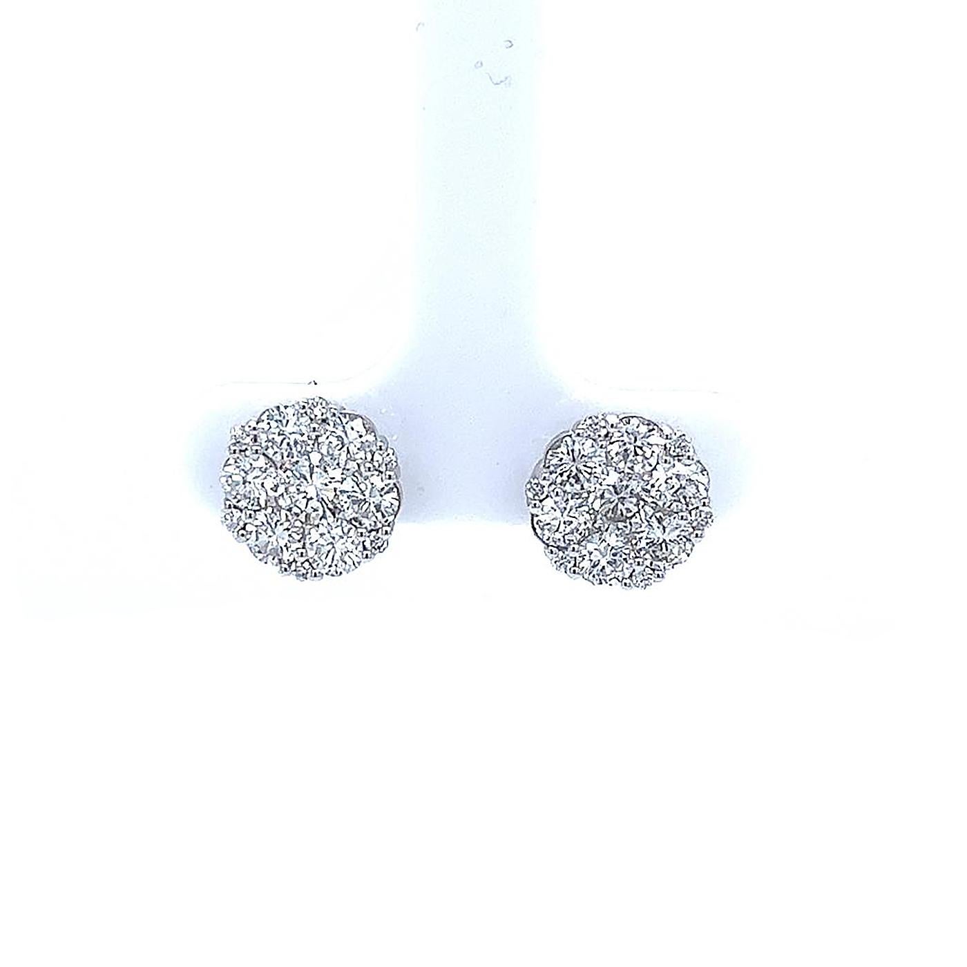 Captivate her with the dazzling and stunning look of these mesmerizing diamond earrings. Beautifully crafted in luminous 14-karat white gold, these gorgeous diamond earrings feature 7 round cut diamonds on each Earring, a perfectly invisible set.