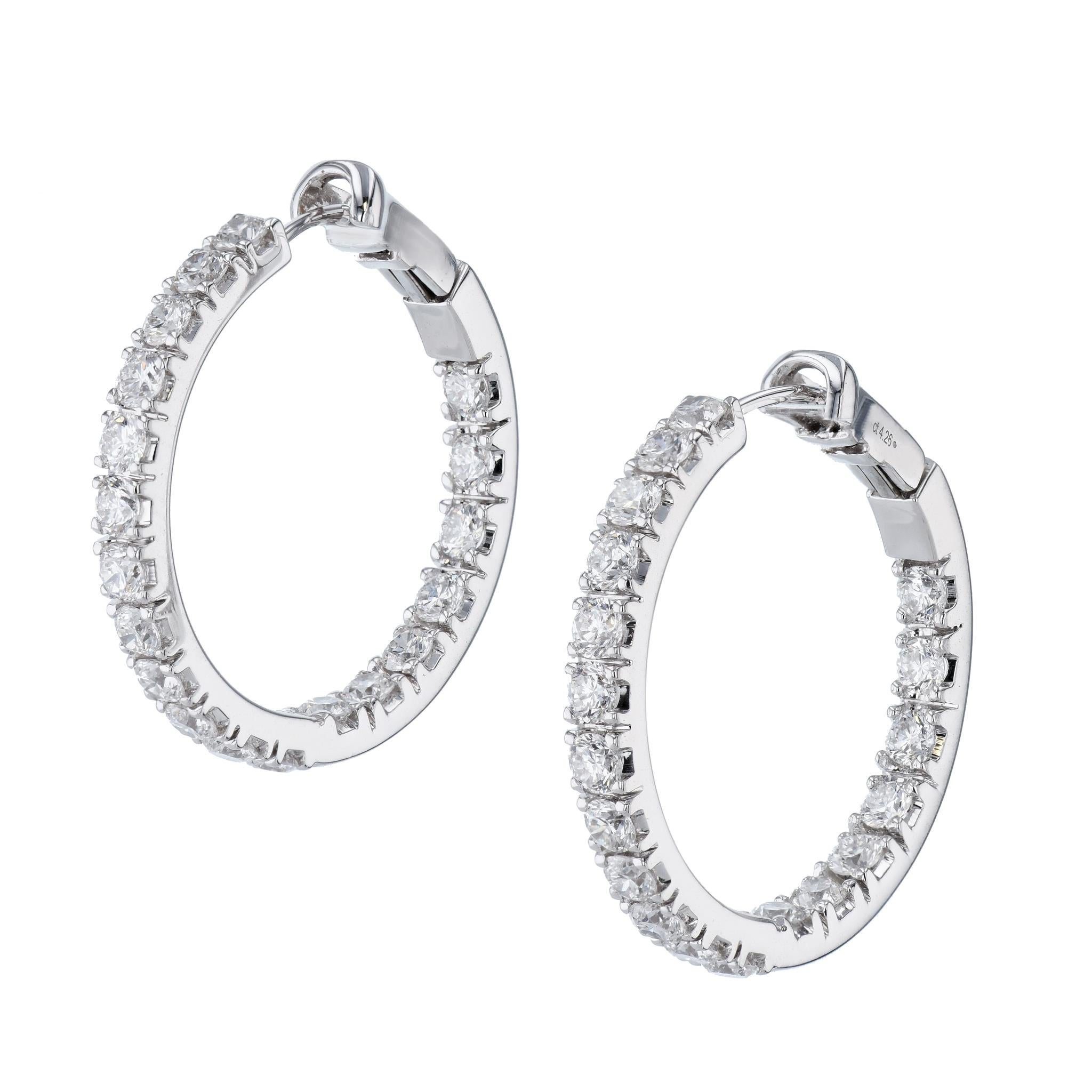 These fabulous hoop earrings have a total of 4.26 total carats of luxurious diamonds. 

They are crafted in 18 karat white gold.

These hoops measure 31 mm in diameter.

Their color is F and the clarity is SI.