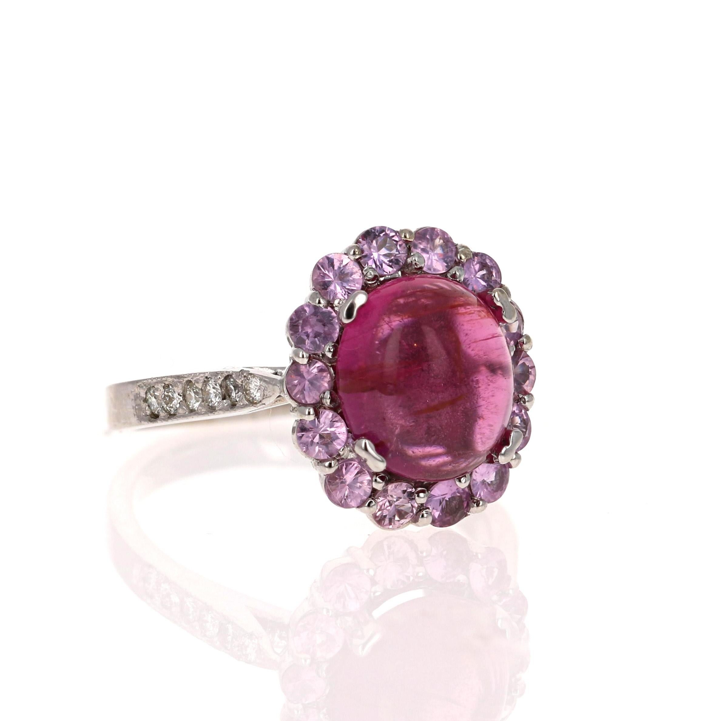 Beautiful and Radiant Pink Tourmaline Ring!

This ring has a Cabochon Pink Tourmaline that weighs 3.25 Carats. Floating around the Tourmaline are 14 Pink Sapphires that weigh 0.85 Carats.  Along the shank there are 12 Round Cut Diamonds that weigh