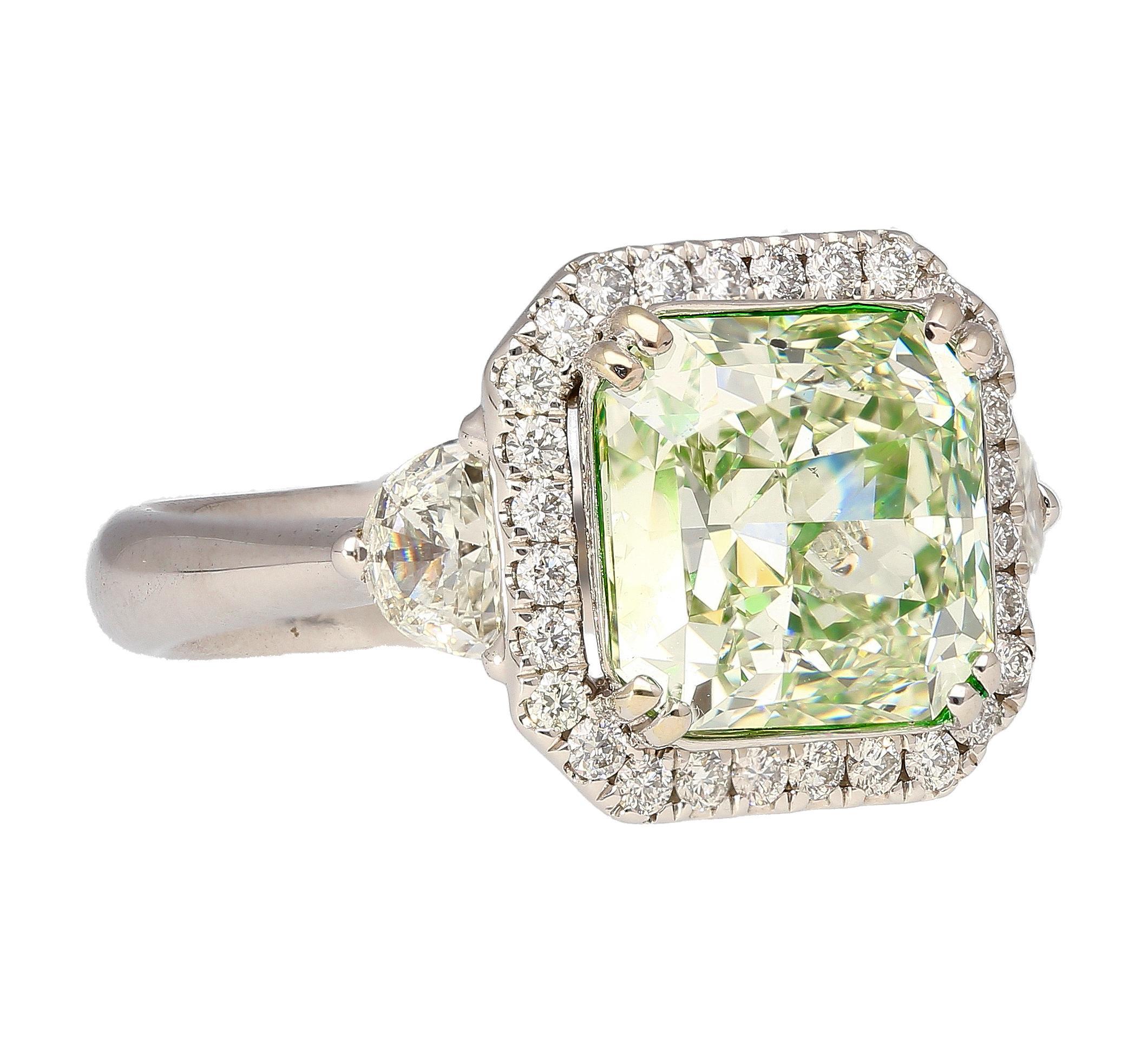Jewelry Details:
Item Type: Diamond Ring
Metal Type: 18K White Gold
Weight: 7.27 grams
Ring Size: 6
Center Stone Details:
Gemstone Type: Diamond
Shape: Radiant Cut
Carat: 4.26 Carats
Color: Fancy Yellowish Green
Clarity: SI1
Certification: GIA