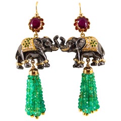 42.60 Carat White Diamond Emerald Ruby Tsavorite Yellow Gold Elephants Earrings