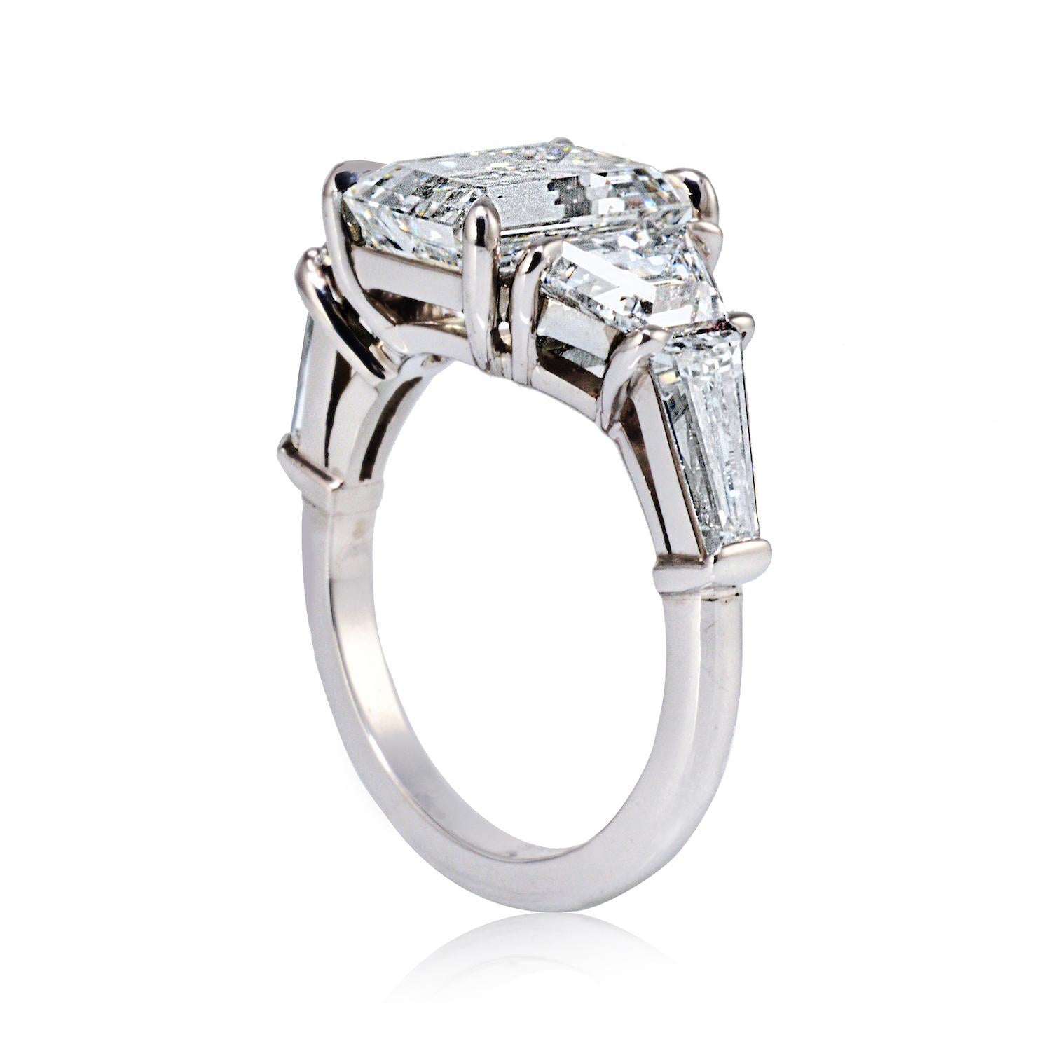 Modern 4.26 Carat Emerald Cut Diamond Three-Stone Platinum Engagement Ring