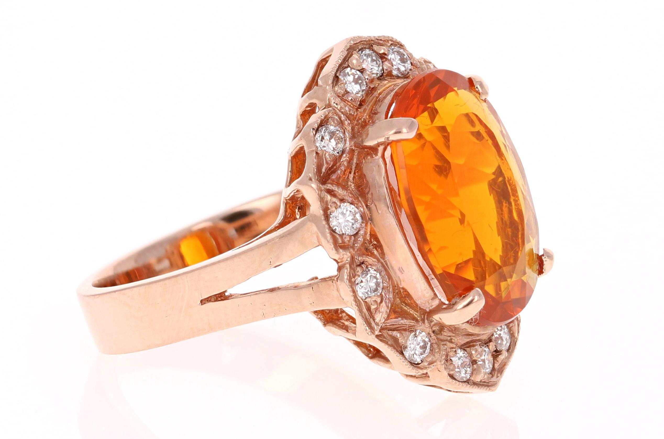 This stunningly ring has a beautiful Orange Oval Cut Fire Opal that weighs 3.97 Carats and 14 Round Cut Diamonds that weigh 0.30 Carats. The clarity and color of the diamonds are VS-H.  The total carat weight of the ring is 4.27 cts.  It is