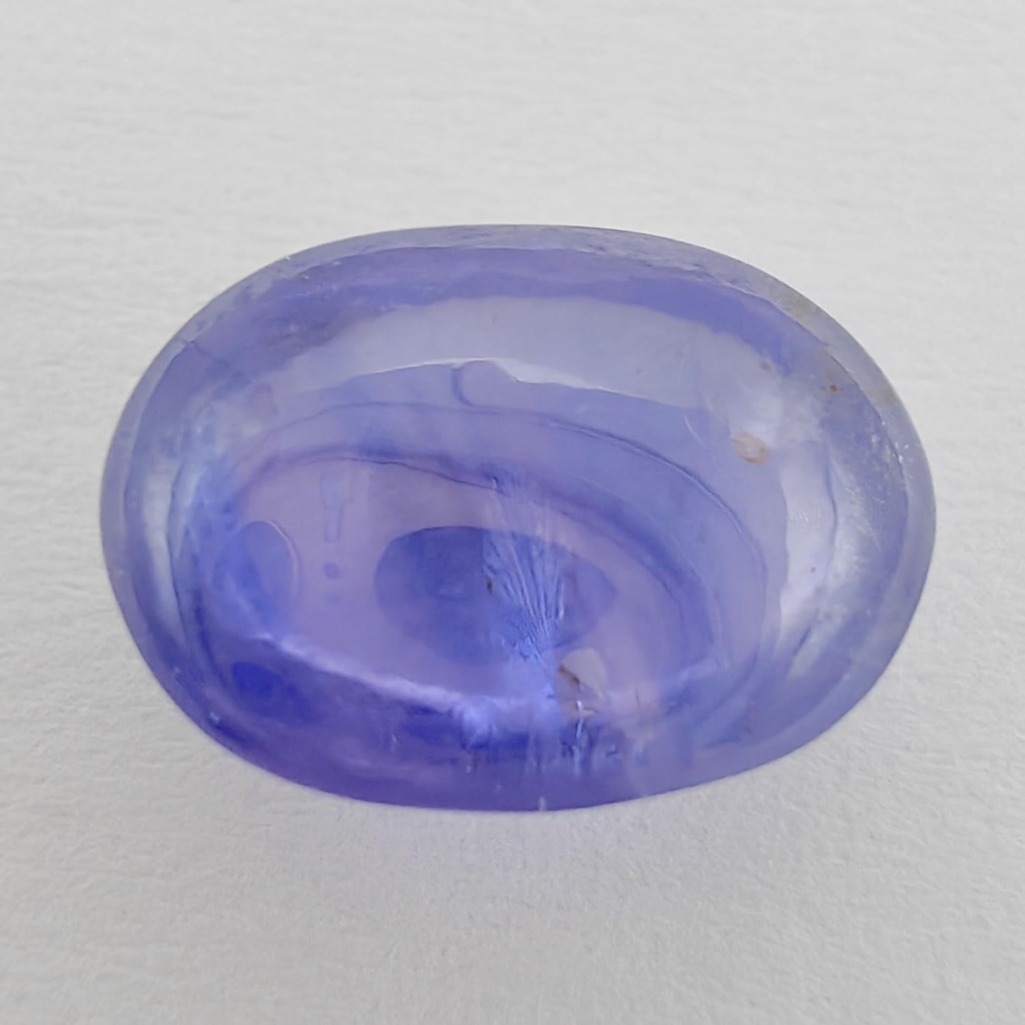 Feast your eyes on this exquisite natural Corundum Sapphire. Weighing at an impressive 4.27 carats and precisely cut in a classic oval cabochon shape, it is truly a gem to behold. Its measurements are an ample 10.25 x 7.38 x 5.31 mm, making it a