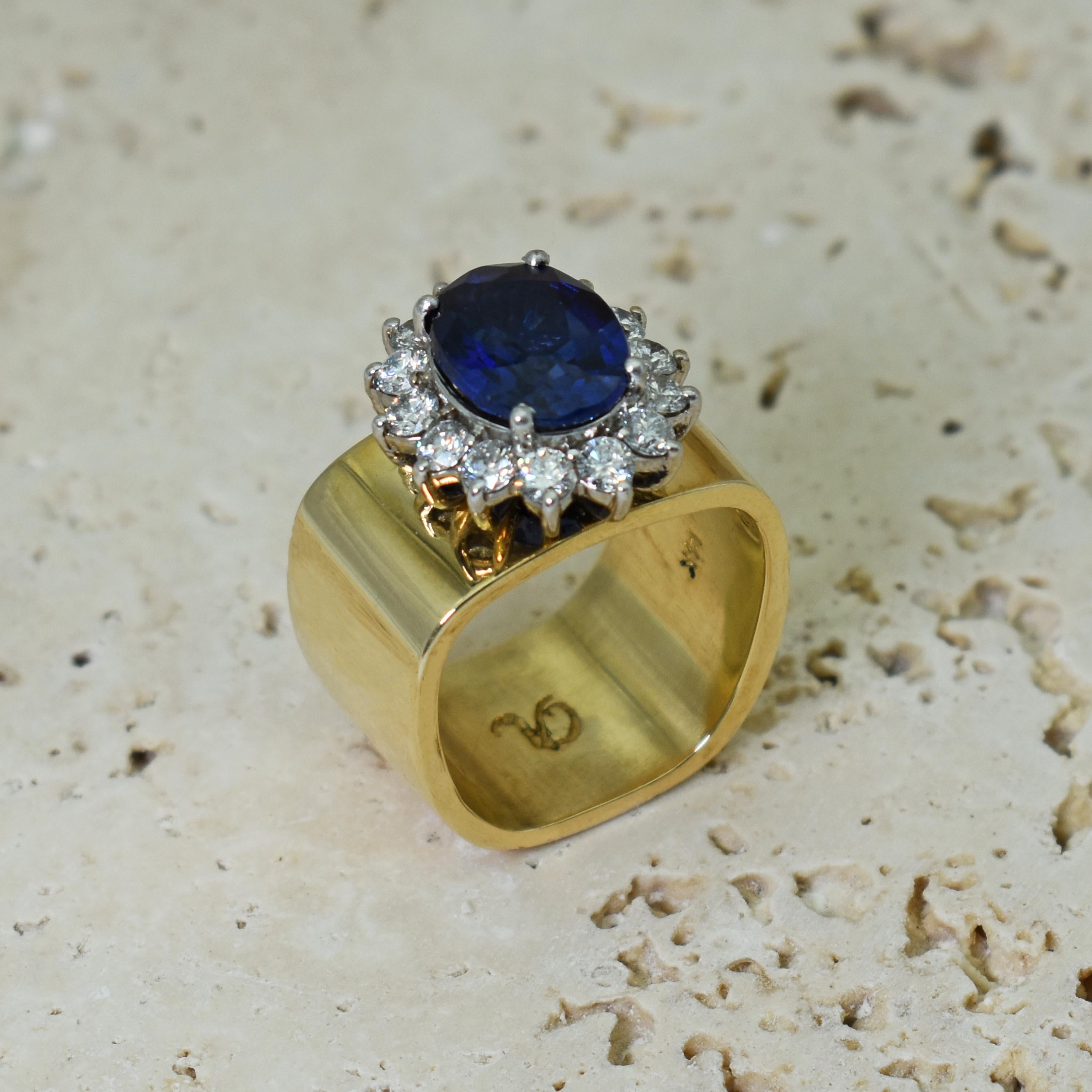Contemporary 4.27 Carat Oval Blue Sapphire and Diamond Halo 14k Gold Cocktail Ring For Sale