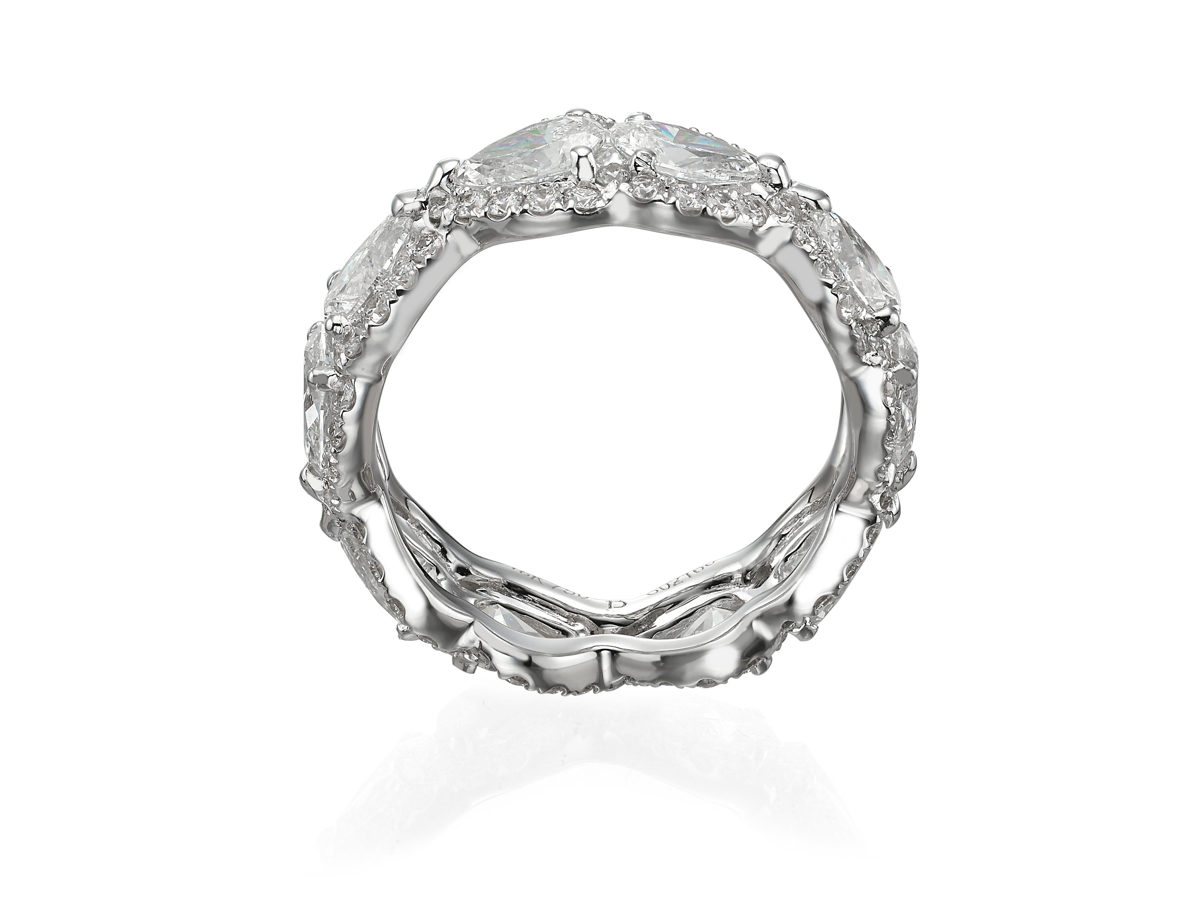 10 pear shape diamonds (totaling 3.23 carats) are encircled by brilliant pavé-set diamond halos (totaling 1.04 carats) in this eye-catching 18K white gold eternity band ring.  Currently a ring size US 7.  For other sizes, please contact