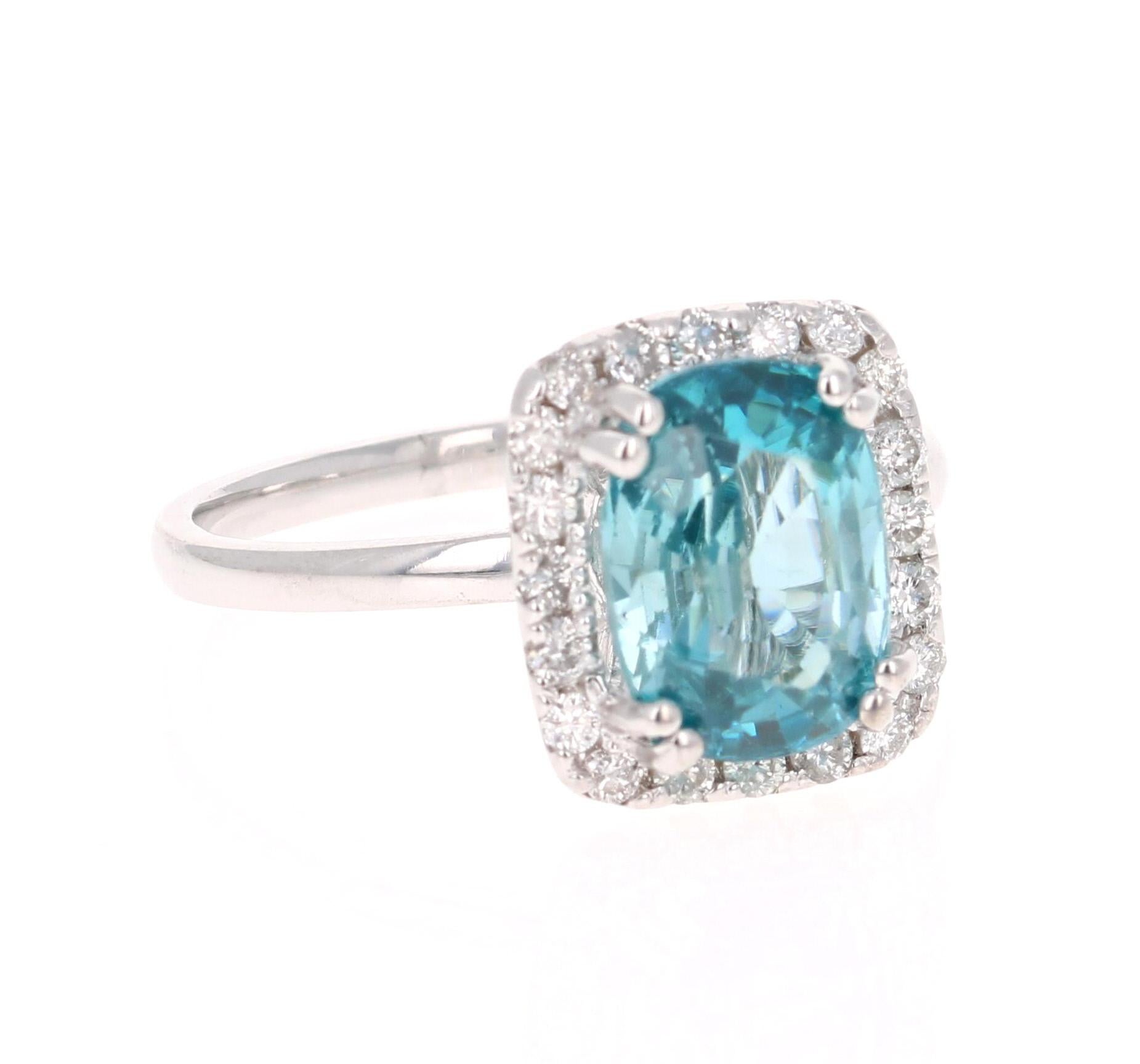A Dazzling Blue Zircon and Diamond Ring! Blue Zircon is a natural stone mined in different parts of the world, mainly Sri Lanka, Myanmar, and Australia. 

This Oval Cut Blue Zircon is 3.94 Carats and is surrounded by a halo of 20 Round Cut Diamonds