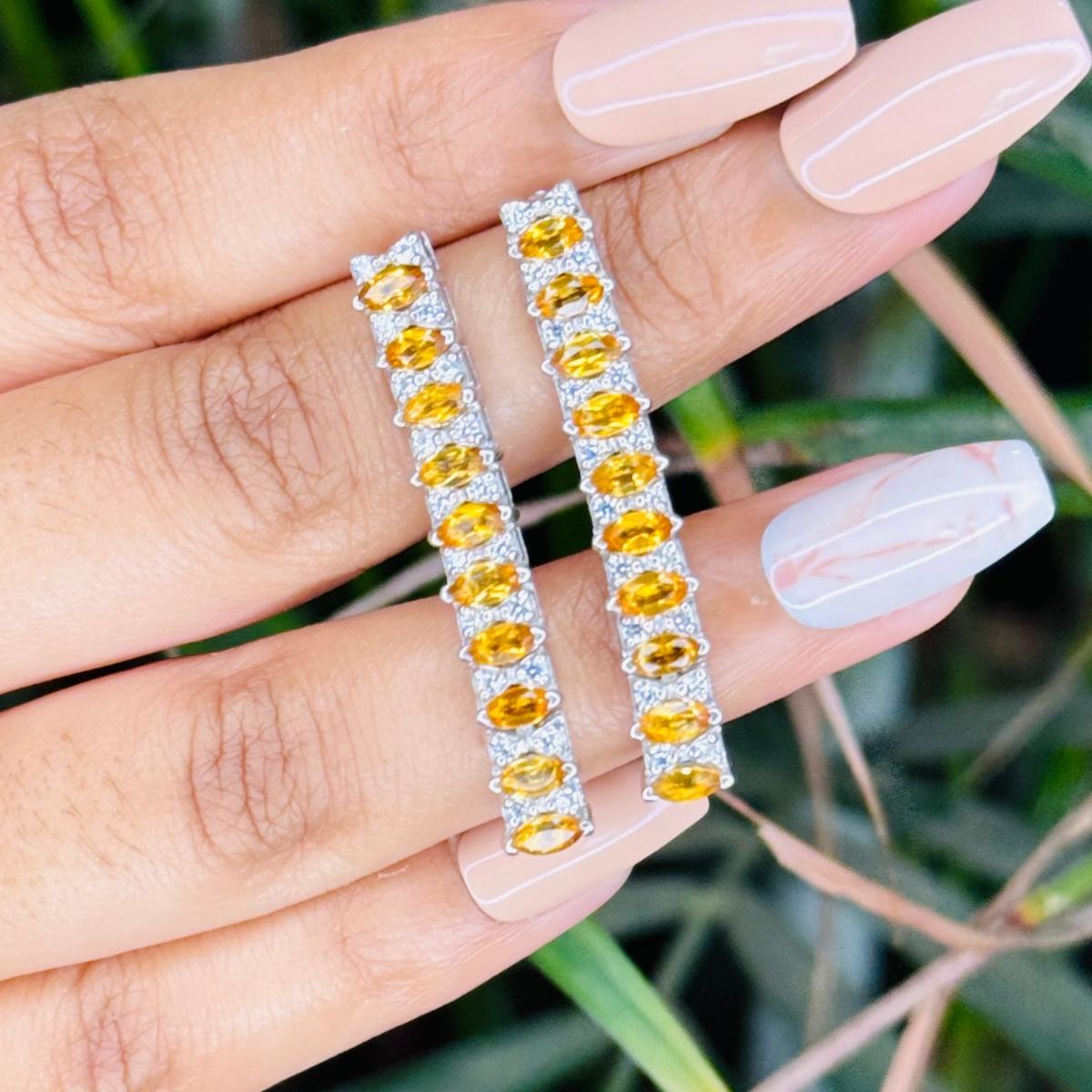 4.28 Carat Citrine Long Linear Dangle Earring in sterling silver to make a statement with your look. You shall need dangle earrings to make a statement with your look. These earrings create a sparkling, luxurious look featuring, marquise cut natural