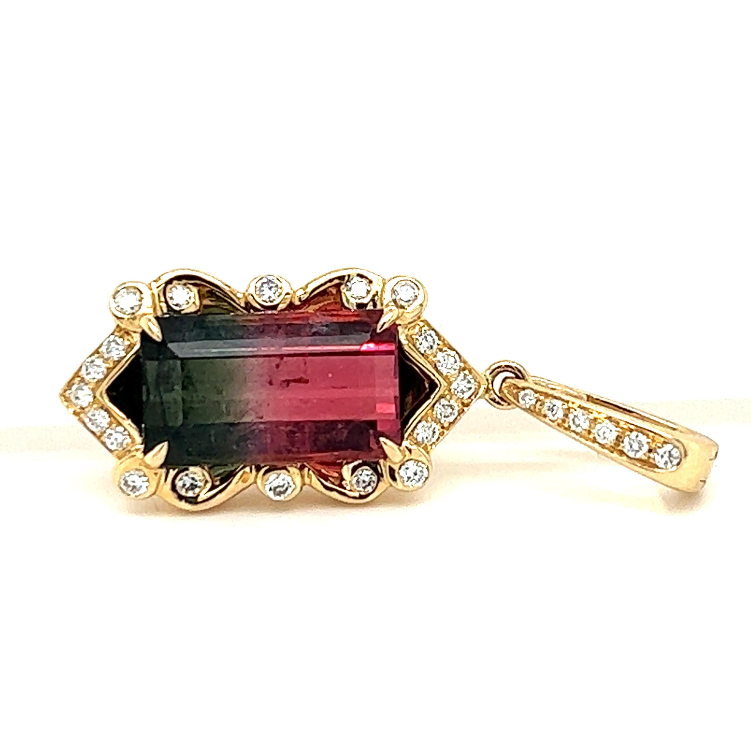 One 14-karat yellow gold pendant set with one 4.28-carat emerald cut watermelon tourmaline and 0.27-carat total weight of round brilliant diamonds with matching H/I color and SI clarity. The pendant is stamped 