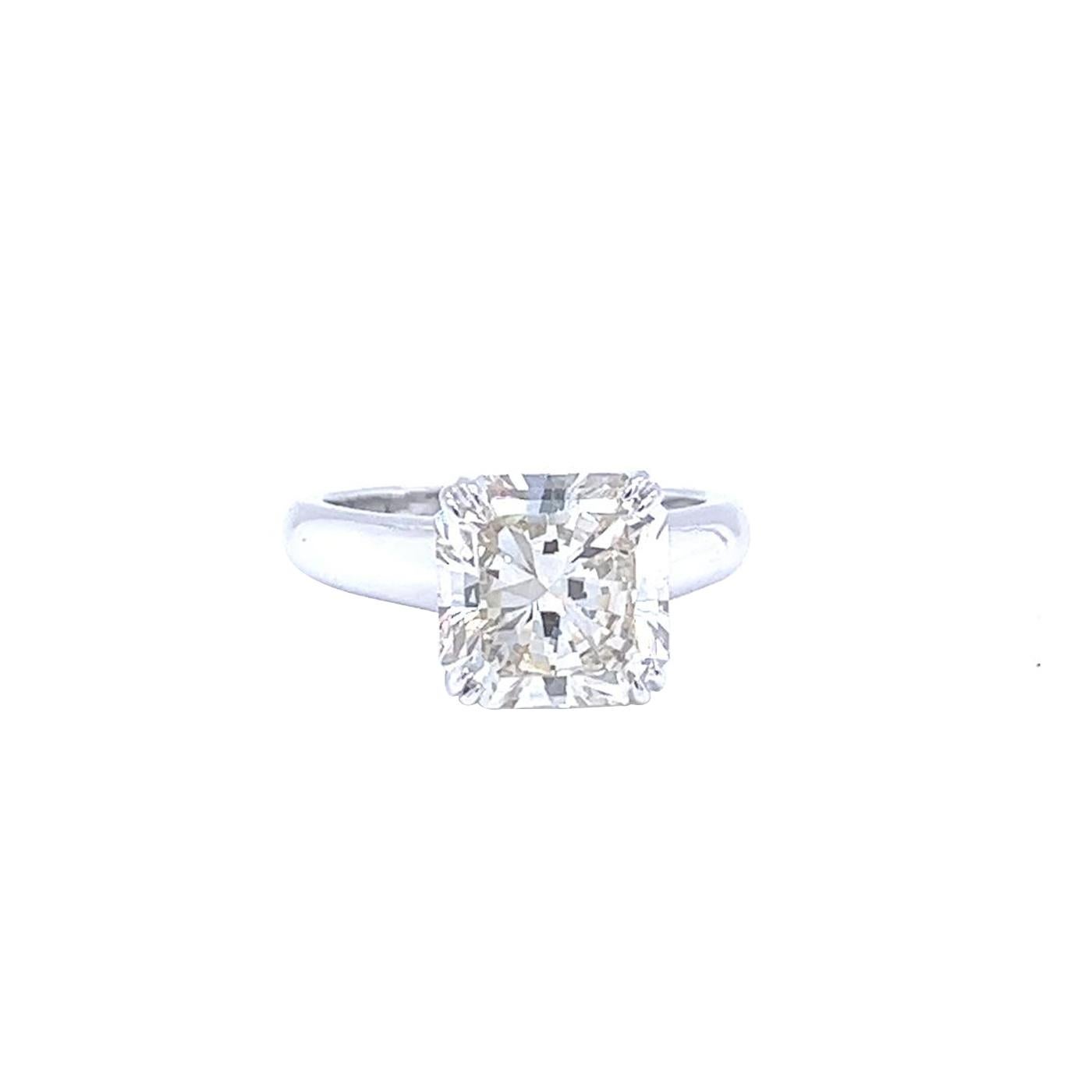 A gorgeous classy platinum diamond ring. The ring is set with a natural radiant cut diamond weighing 4.28ct, L color, and VS1 in clarity set within a classic mount. The ring is currently size 6 but can be adjusted for a perfect fit. This diamond is