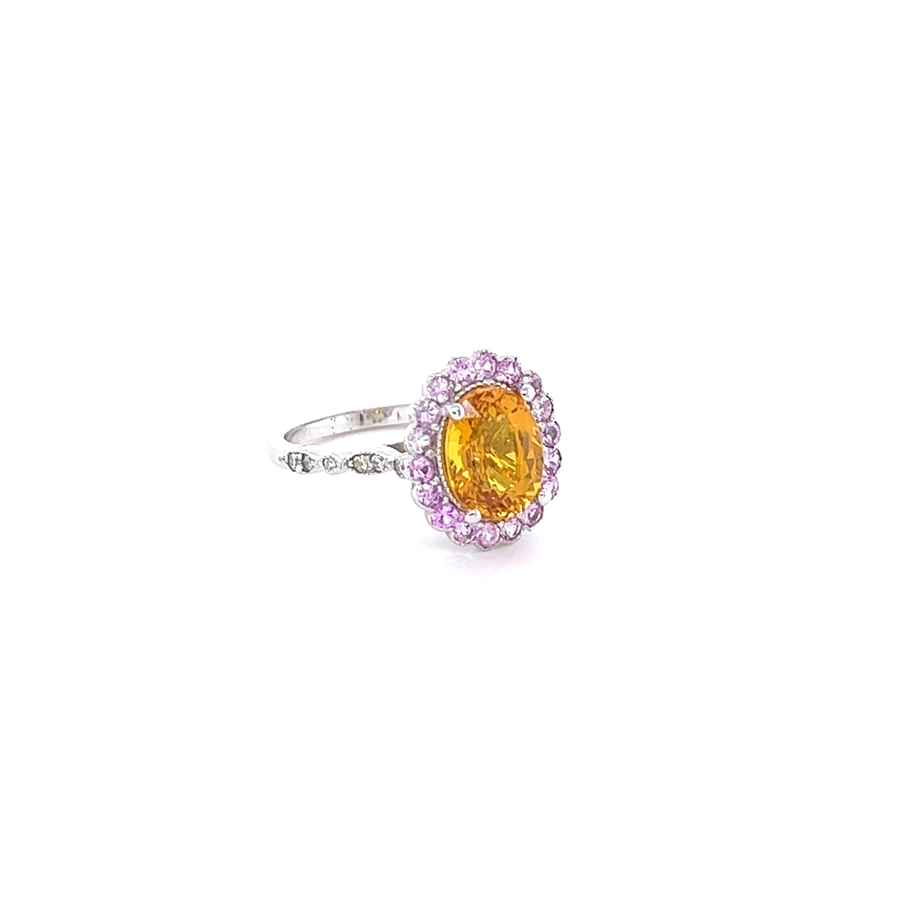This beautiful ring has a Oval Cut Orange Sapphire that weighs 3.48 carats and measures at approximately 10 mm x 8 mm. The Orange Sapphire is Heated as per industry standards.

It is surrounded by a halo of 18 Pink Sapphires that weigh 0.65 Carats