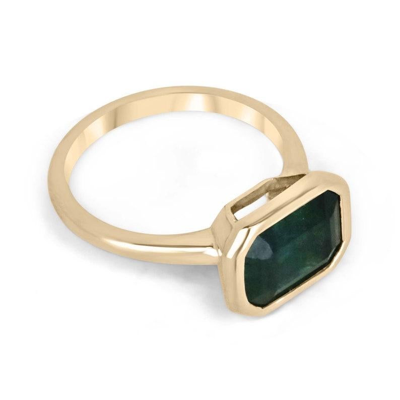 Introducing a captivating solitaire women's ring, featuring a magnificent 4.28-carat emerald that exudes an aura of natural beauty. Set horizontally, east to west, the emerald showcases a captivating dark alpine green color that evokes a sense of