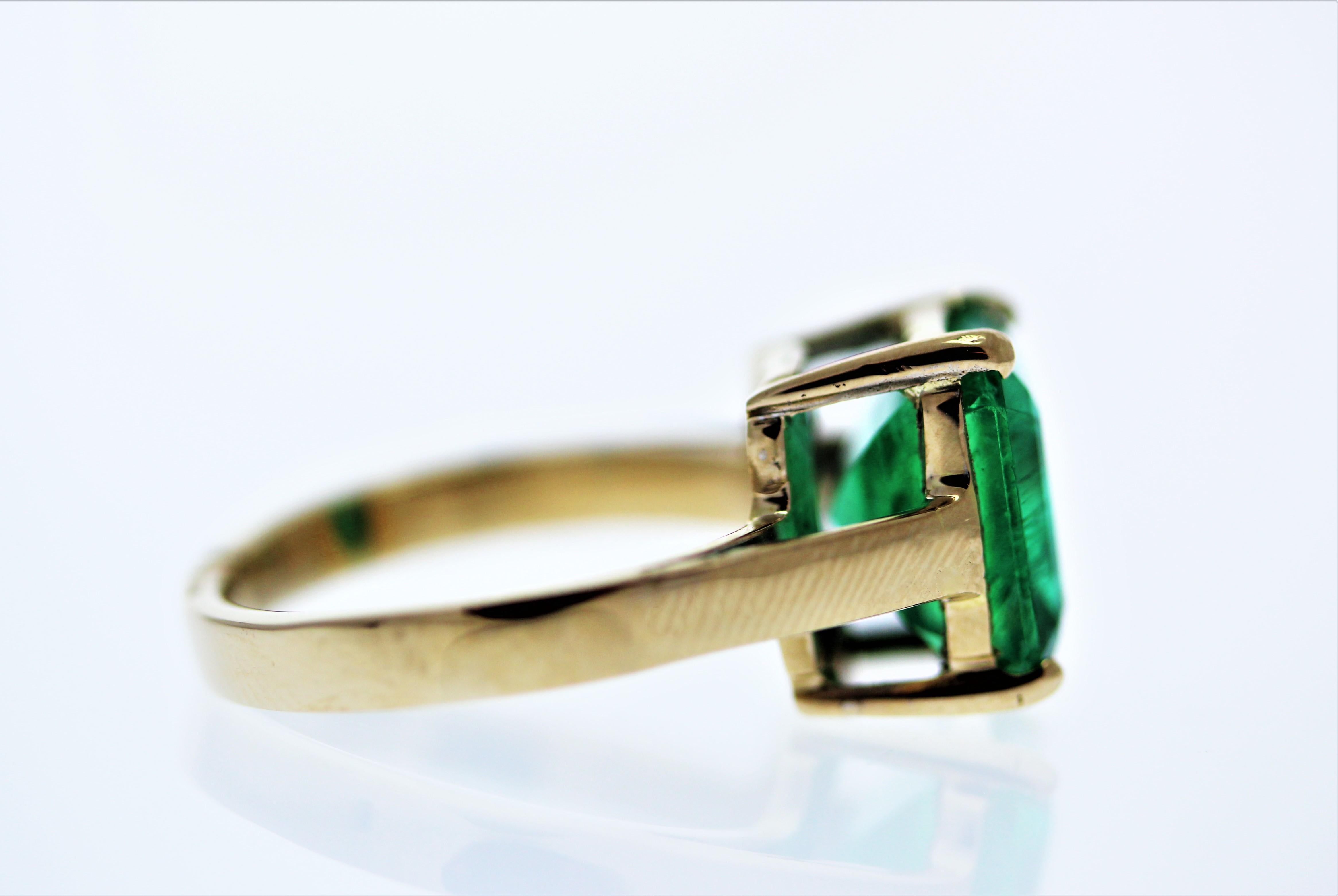 Would you look at this beauty! Simple in design, but there is nothing ordinary about the gorgeous color of this breathtaking green emerald ring. This stunning piece features an emerald cut 4.28 carats emerald, set into a four-prong. The emerald is