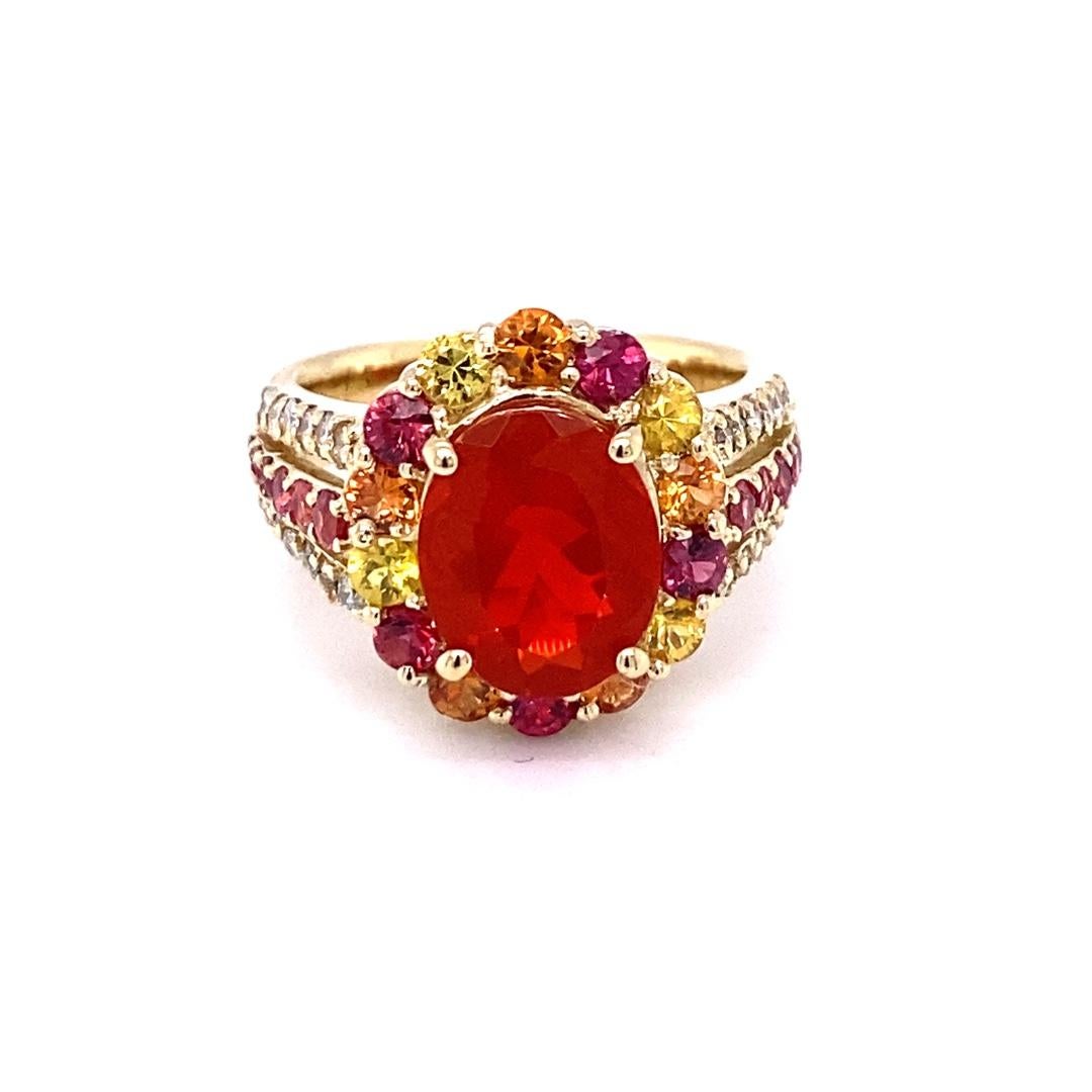 Contemporary 4.29 Carat Oval Cut Fire Opal Sapphire Diamond Yellow Gold Cocktail Ring For Sale