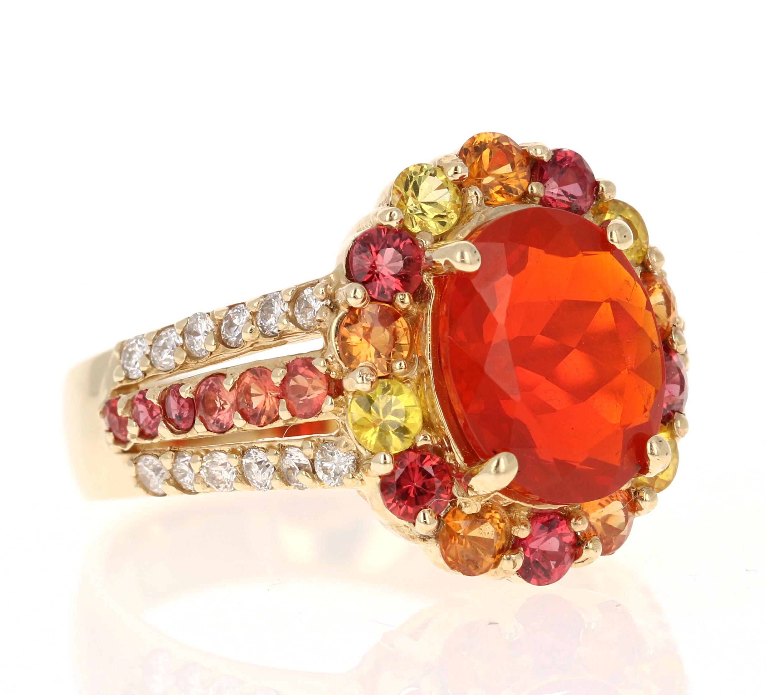 Super gorgeous and uniquely designed 4.29 Carat Fire Opal and Multicolor Sapphire and Diamond 14K Yellow Gold Cocktail Ring

This ring has a 2.15 carat Oval Cut Fire Opal as its center stone and is elegantly surrounded by 26 Round Cut Multi Color