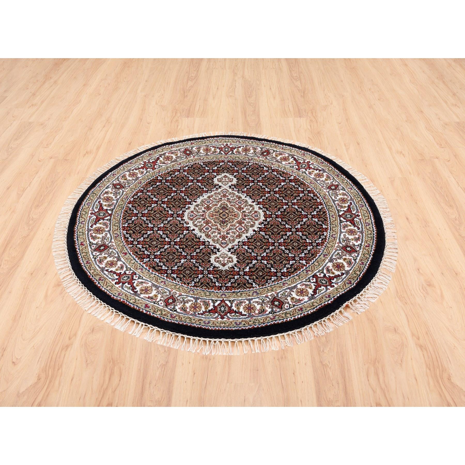 This is a truly genuine one-of-a-kind Black Round Tabriz Mahi Fish Medallion Design Wool Hand Knotted Oriental Rug. It has been Knotted for months and months in the centuries-old Persian weaving craftsmanship techniques by expert artisans.
Primary