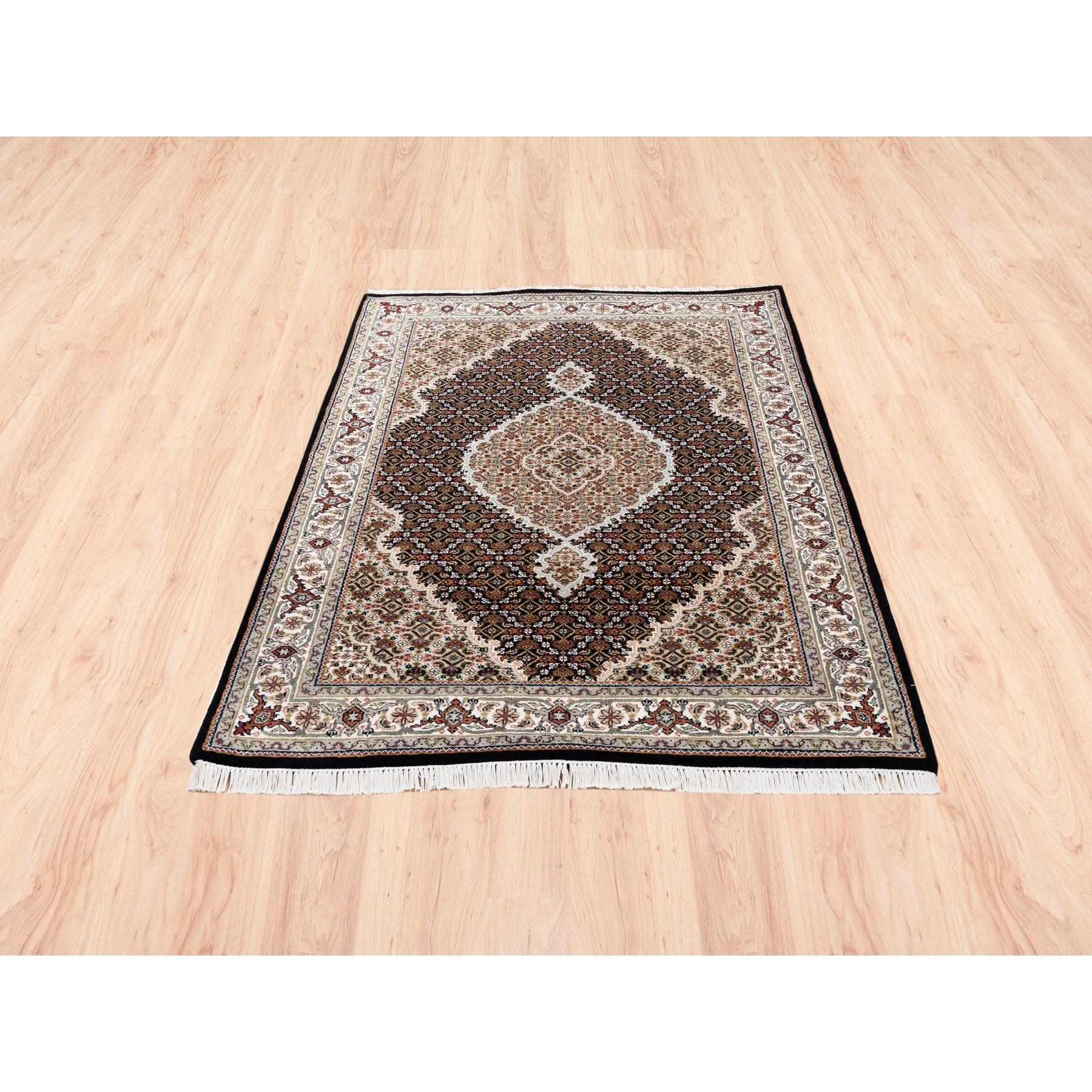 This is a truly genuine one-of-a-kind Hand Knotted Black Tabriz Mahi Fish Medallion Design Wool And Silk Oriental Rug. It has been Knotted for months and months in the centuries-old Persian weaving craftsmanship techniques by expert