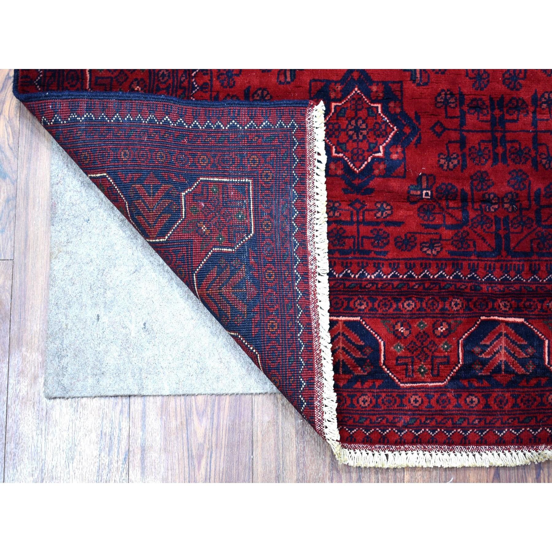 This is a truly genuine one-of-a-kind Deep and Saturated Red Hand Knotted Vegetable Dyes Afghan Khamyab Natural Wool Oriental Rug. It has been Knotted for months and months in the centuries-old weaving craftsmanship techniques by expert