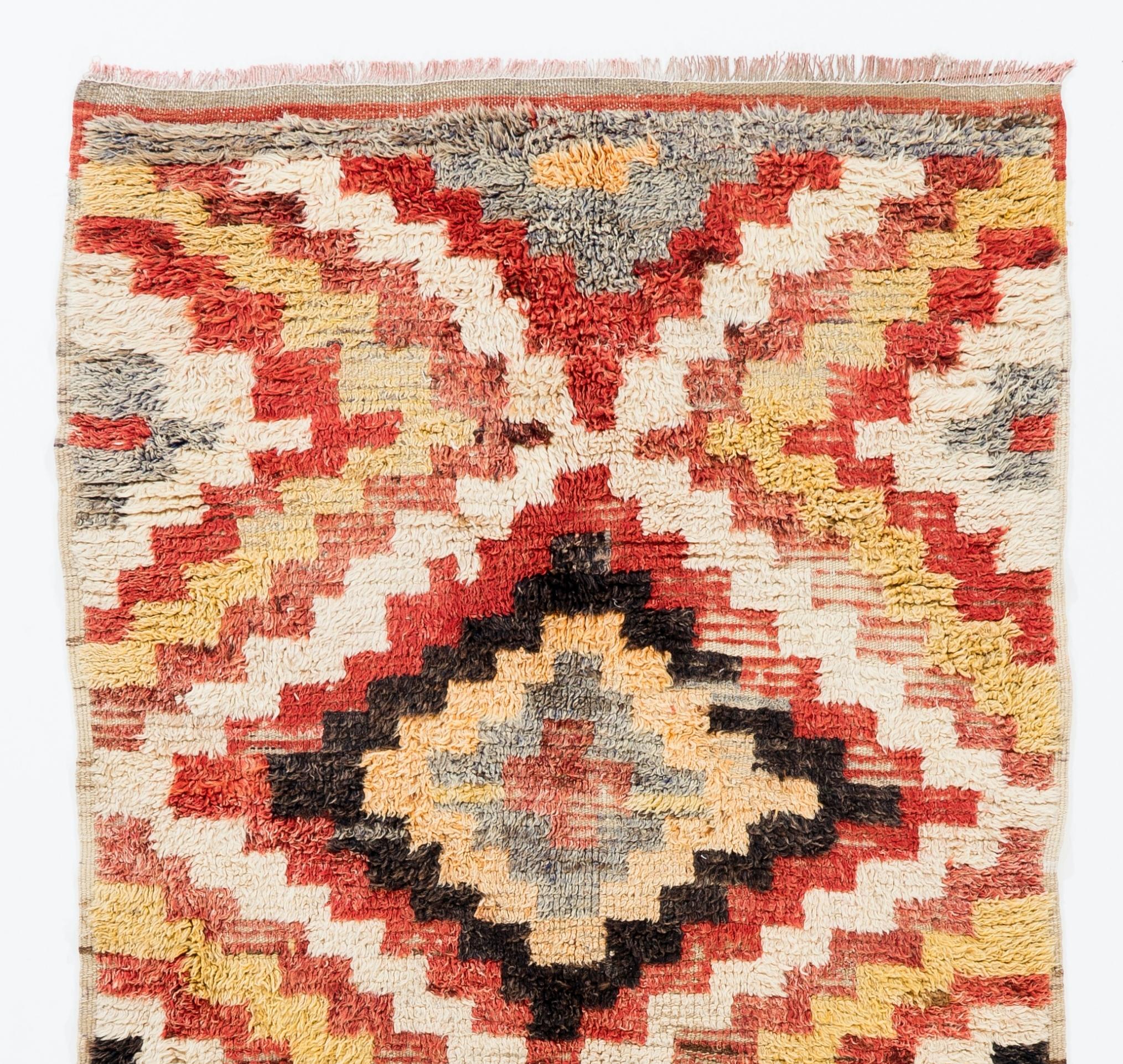 A handmade mid-century 'Tulu' (Turkish word for 'thick piled') runner rug from Konya in Central Turkey. The rug is made of 100% wool, therefore it is very soft and comfortable. Measures: 4.2 x 8 Ft.

These simple rugs with geometric modern designs