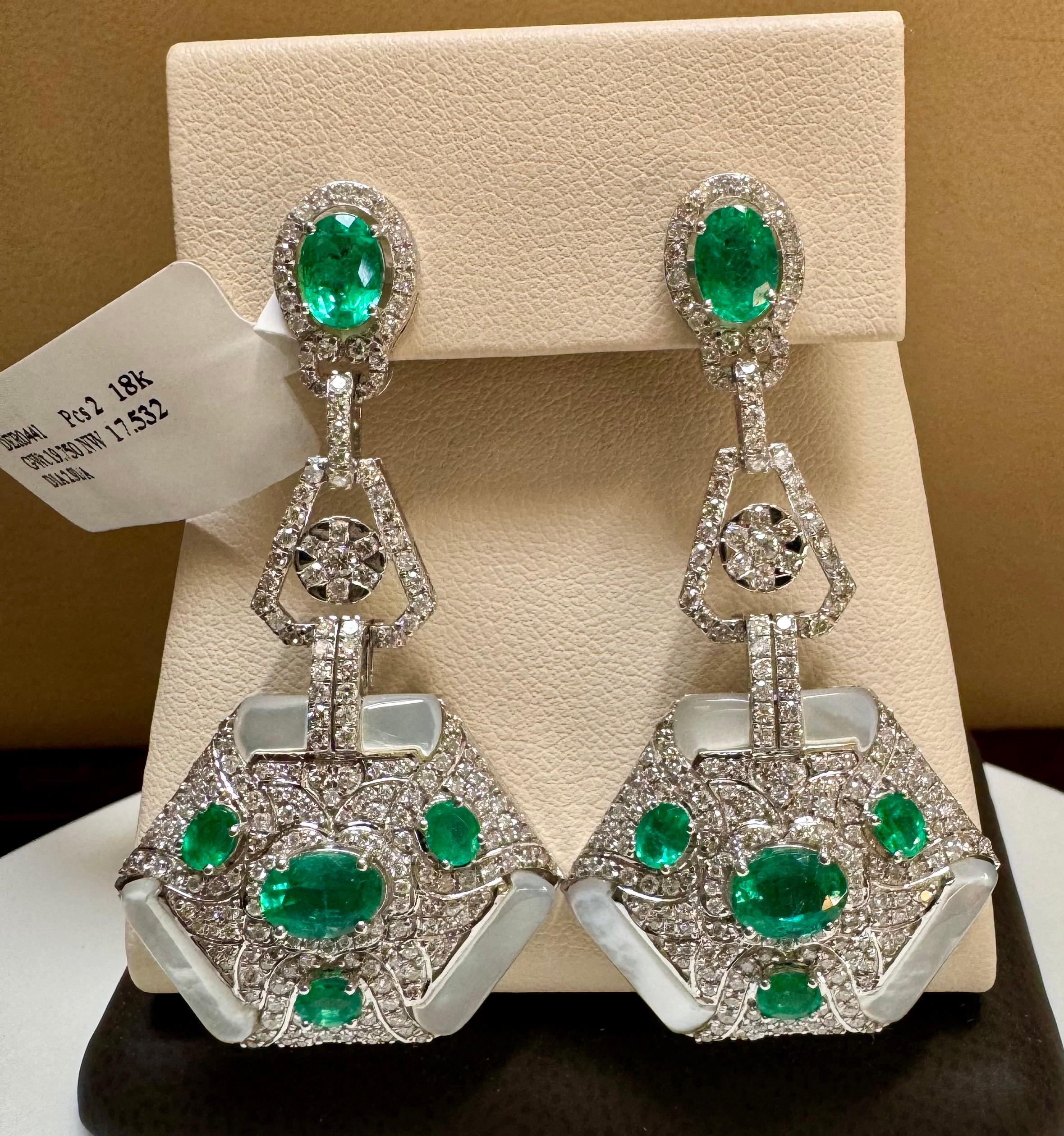 4.3 Carat Emerald & 2.91 Ct Diamond With Mother Of Pearl  Hanging Earrings 18 Karat White Gold

This exquisite pair of earrings are beautifully crafted with 18 karat White gold  weighing    
 19.75 grams
Multiple oval shape  fine Natural  Emeralds