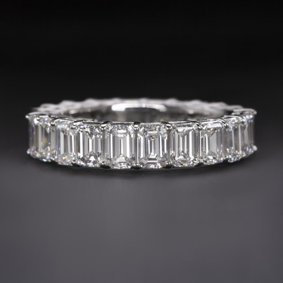 Eternity band ring features approximately 4.30 ct of vibrant emerald cut diamonds set in a modern and elegantly simple band. 
High quality, perfectly matched and substantial sized diamonds cover the entire diameter of the ring with a dazzling