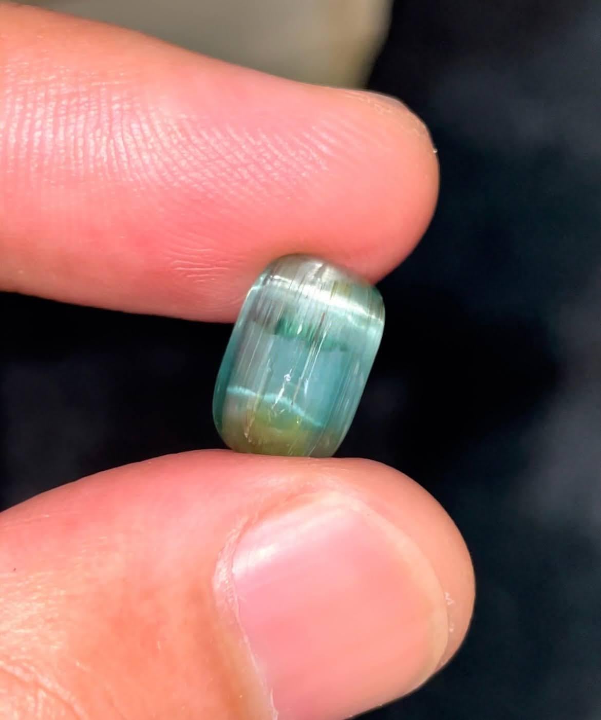 Weight 4.30 carats 
Dimensions 11.90x7.85x5.30 mm
Treatment none 
Origin Afghanistan 
Diaphaneity translucent
Shape oval 
Cut cabochon 




The 4.30 carats Cat’s Eye Tourmaline Stone is a mesmerizing natural gemstone sourced from Afghanistan,