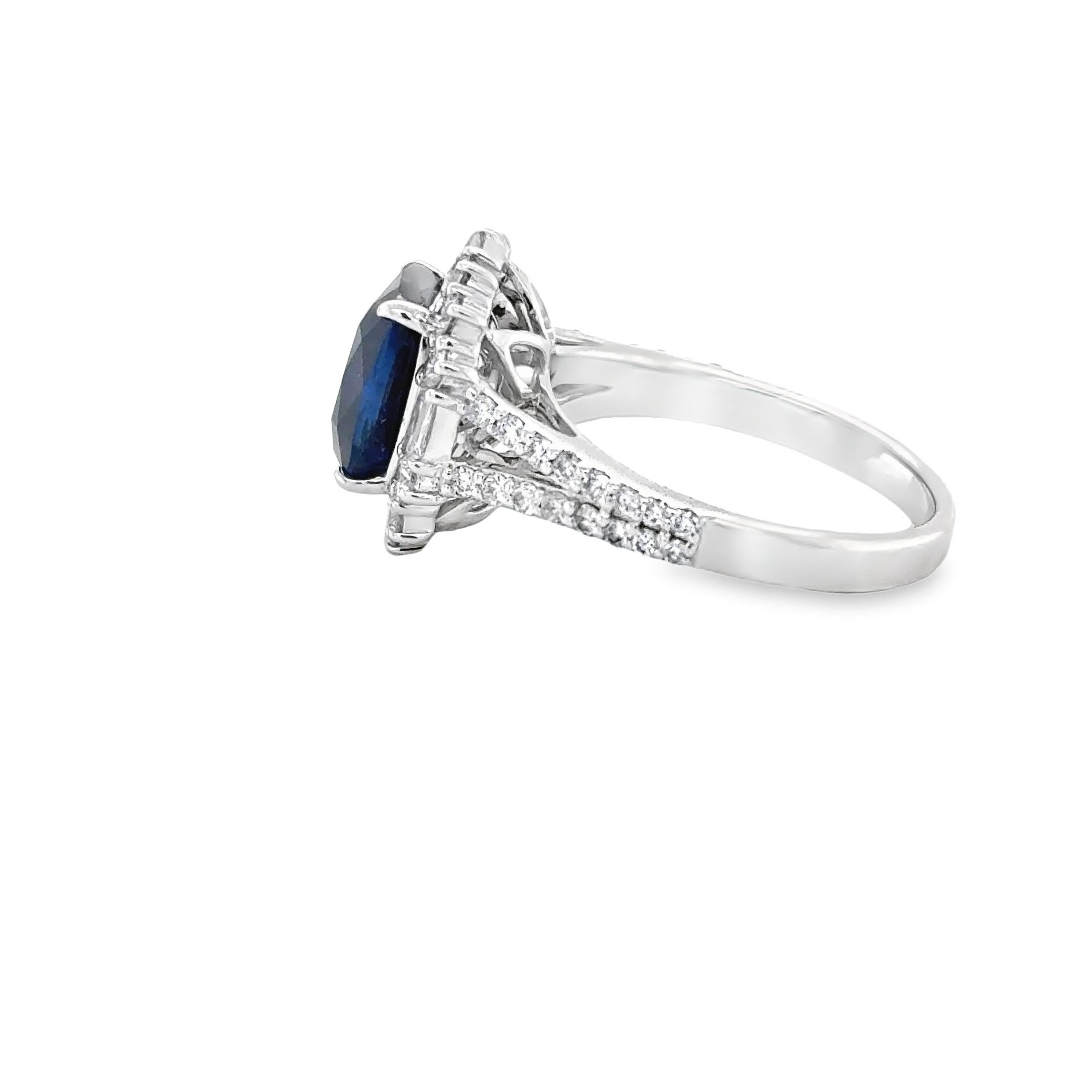 This Gorgeous Cocktail ring is set with a royal blue sapphire weighing 4.30cts , open back setting. The gemstone is perfectly set in the centre of a beautiful cluster of 48 Baguette & Round round shaped diamonds weighing an approximate total weight