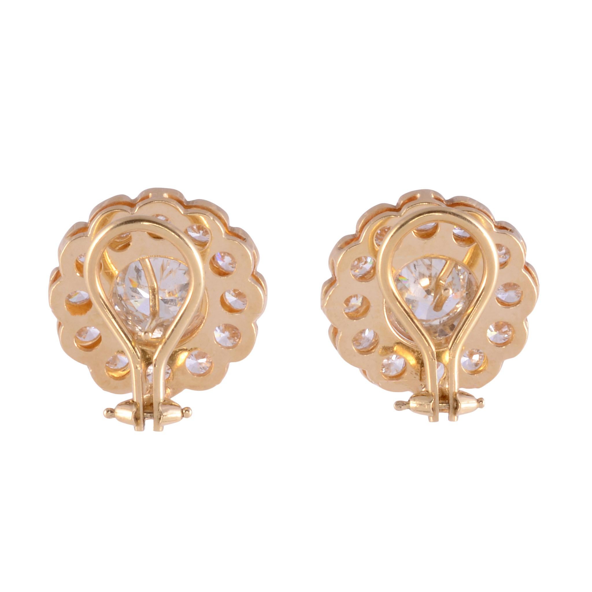 Estate 5.42 CTW rosette diamond earrings. These 18 karat yellow gold rosette earrings feature center round brilliant cut diamonds at 1.36 and 1.26 carats. They are SI1 & SI2 clarity respectively, and both K color. Accented with 24 round brilliant