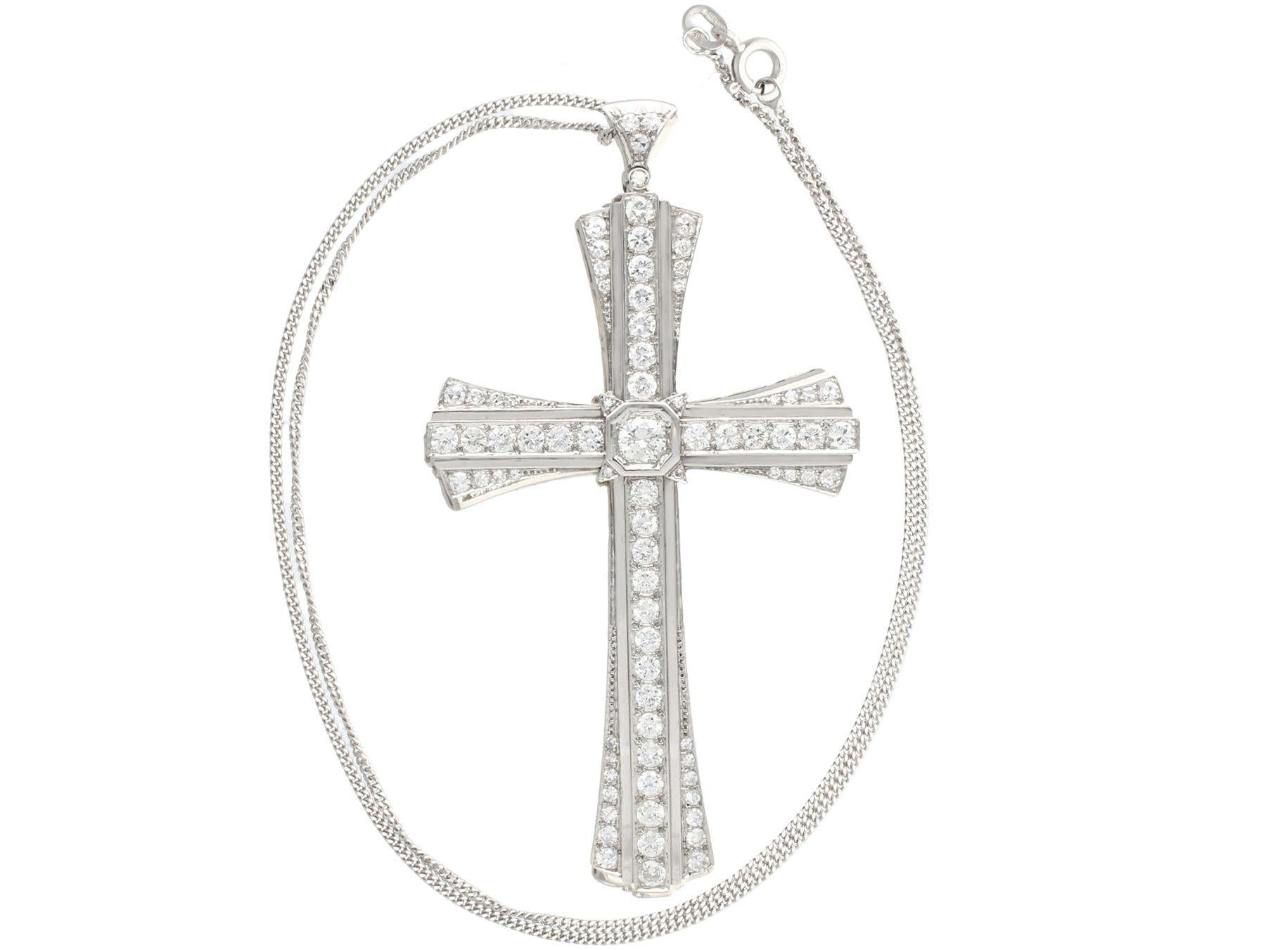 A stunning and large antique 1930s 4.31 carat diamond and platinum cross design pendant; part of our diverse antique estate jewelry collections.

This stunning, fine and impressive antique diamond pendant has been crafted in platinum.

This antique