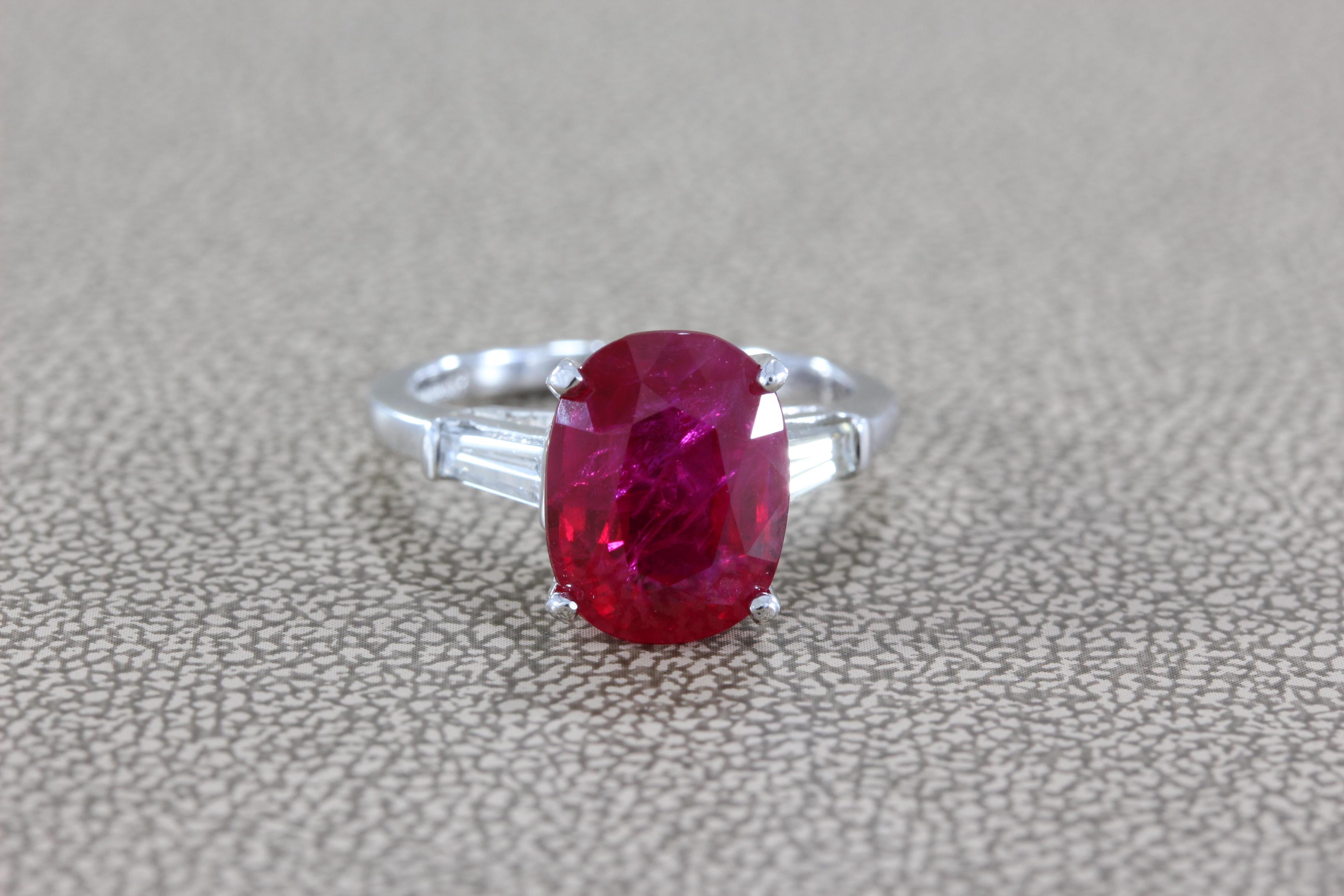 A magnificent ring featuring a GIA certified 4.31 carat gem highly saturated red ruby. Two baguette cut diamonds accent the center gemstone, set in platinum. 

GIA #1172771507 accompanies the ring.  
Size 5.50 (Sizable)