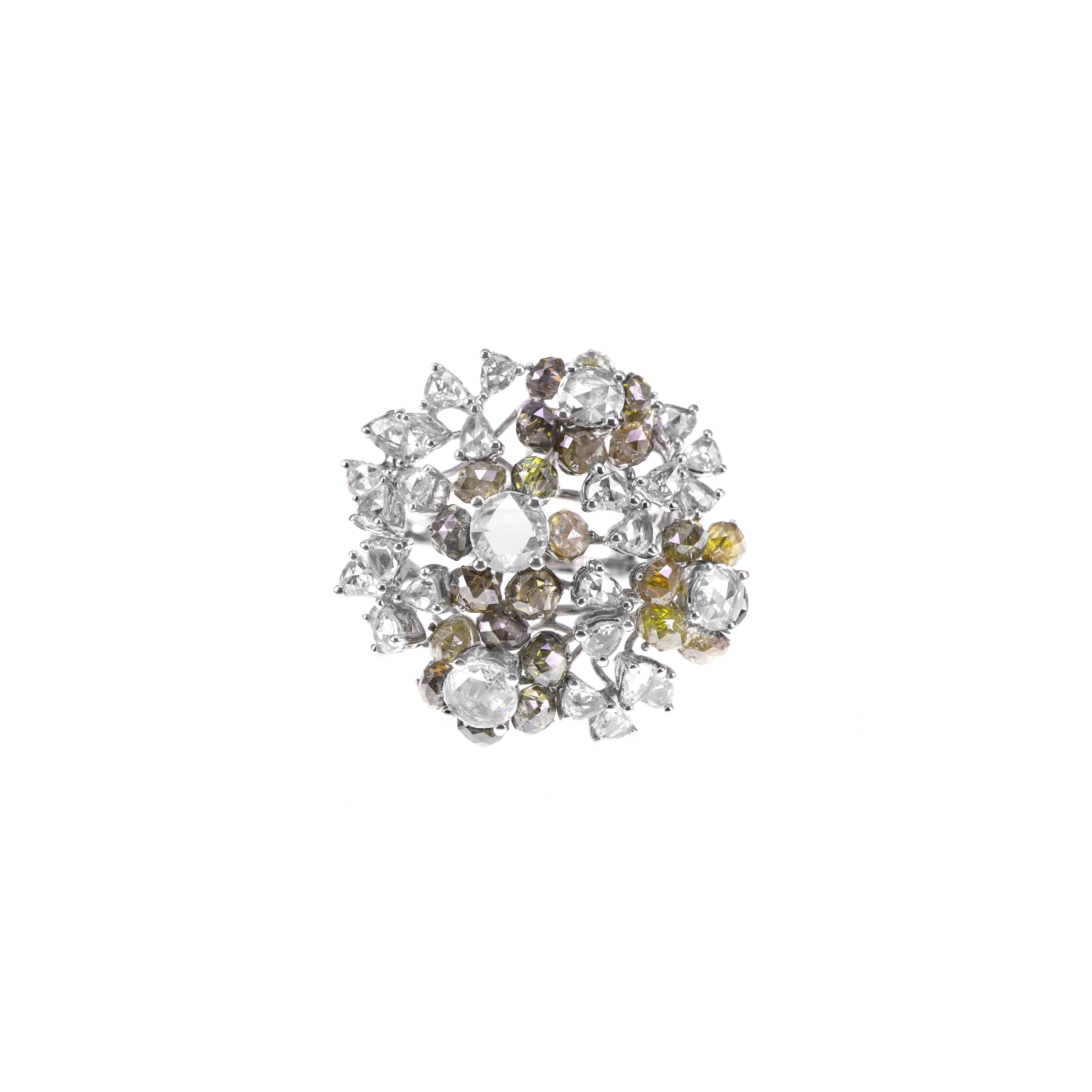 In this quirky ring, 4.31 carat of green diamond beads are set with 1.90 carat of white brilliant diamond and white European old cuts. The ring is made in 18 K gold and has been hand made in Hong Kong. 
The details of the ring are mentioned