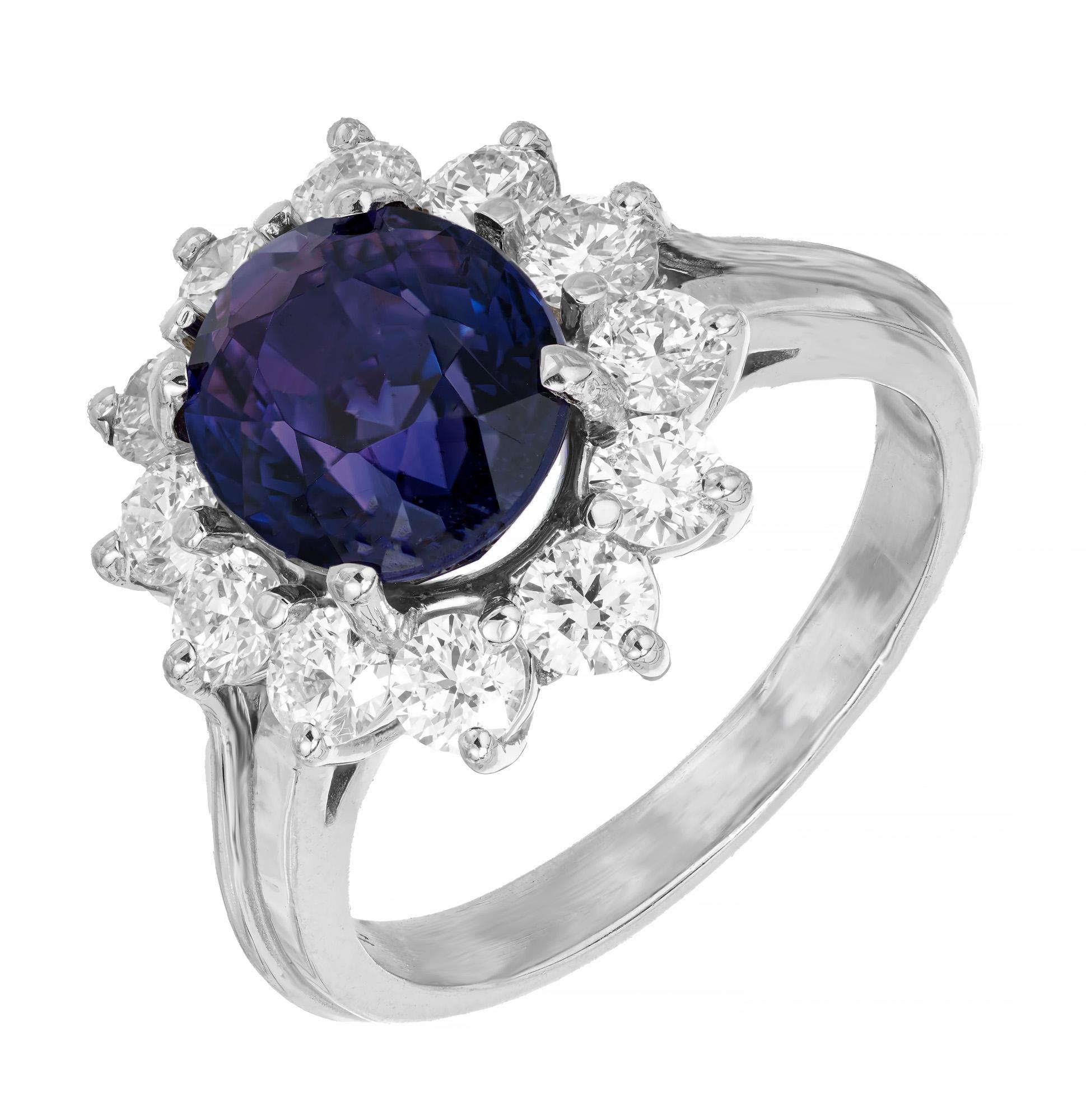1950's oval sapphire diamond halo engagement ring. AGTA certified oval simple heat only, natural corundum center sapphire with a halo of 12 round ideal cut diamonds in a handmade 14k white gold wire setting. The Sapphire changes color from Purple