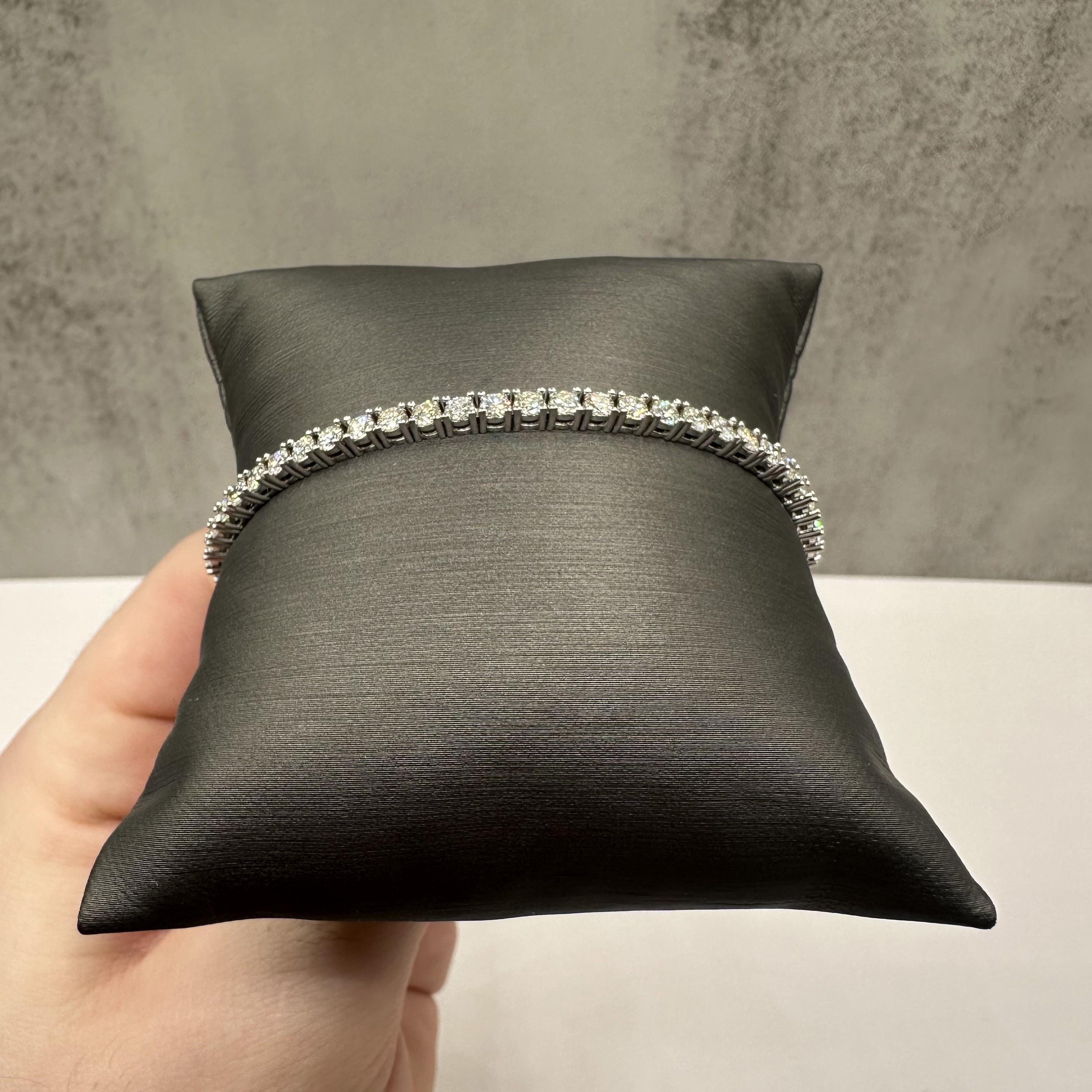 This stunning 4.31ctw Diamond Tennis Bracelet in 14kt white gold features HI VS round diamonds, offering exceptional sparkle and elegance. With a 7-inch length, it fits comfortably for most wrist sizes. Weighing 8.9 grams, the bracelet is