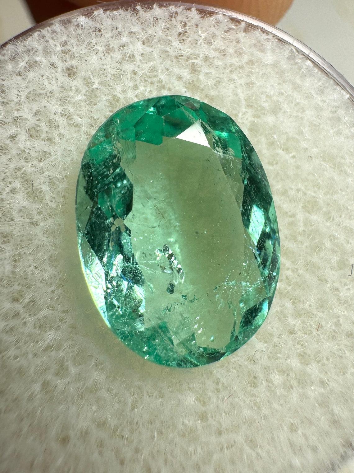 Stone: Emerald
Weight: 4.32-carats
Shape: Oval Cut
Clarity: Transparent
Luster: Excellent
Color: Seafoam Light Green
Measurements: 13.11mm x 9.81mm x 5.43mm
Geographic Origin: Colombia
Treatment: Natural, Oiling

Comments: Due to their growth