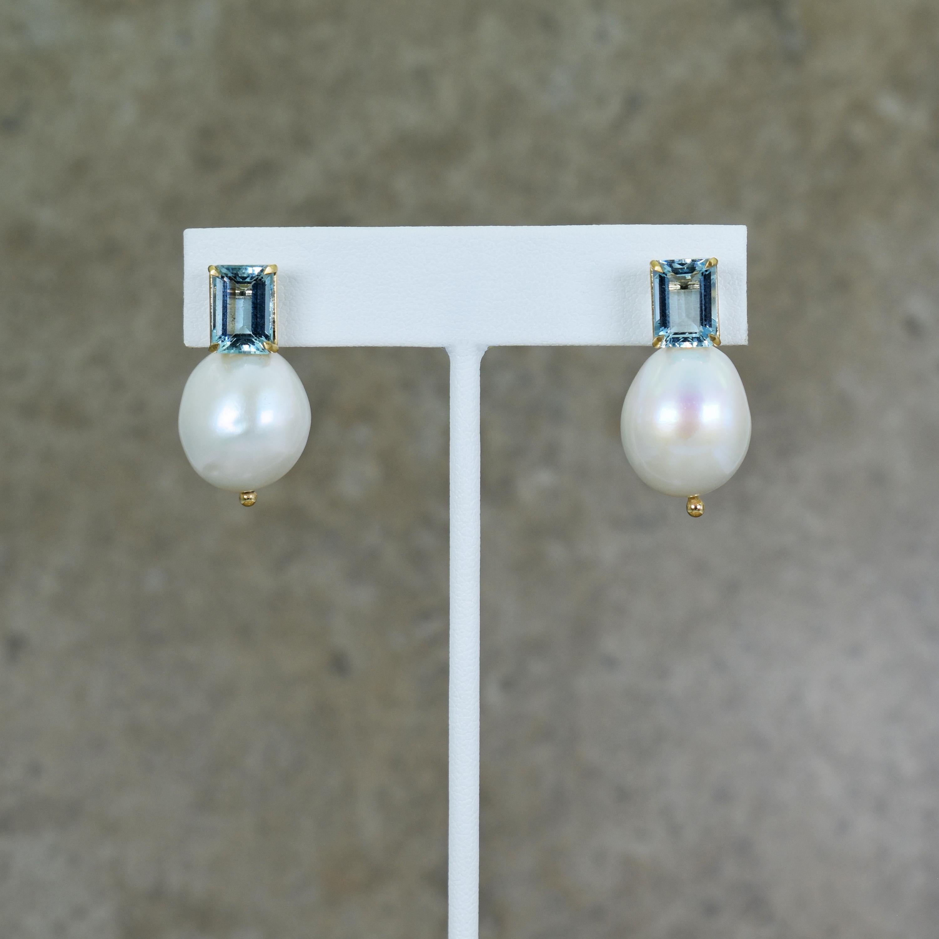 4.32 total carat emerald-cut Aquamarine and oval Freshwater Pearls 14k yellow gold drop stud earrings. Drop earrings are 1.13 inches in length. Freshwater Pearls are between 16mm and 17mm in size. Tranquil, greenish-blue Aquamarine gemstones and