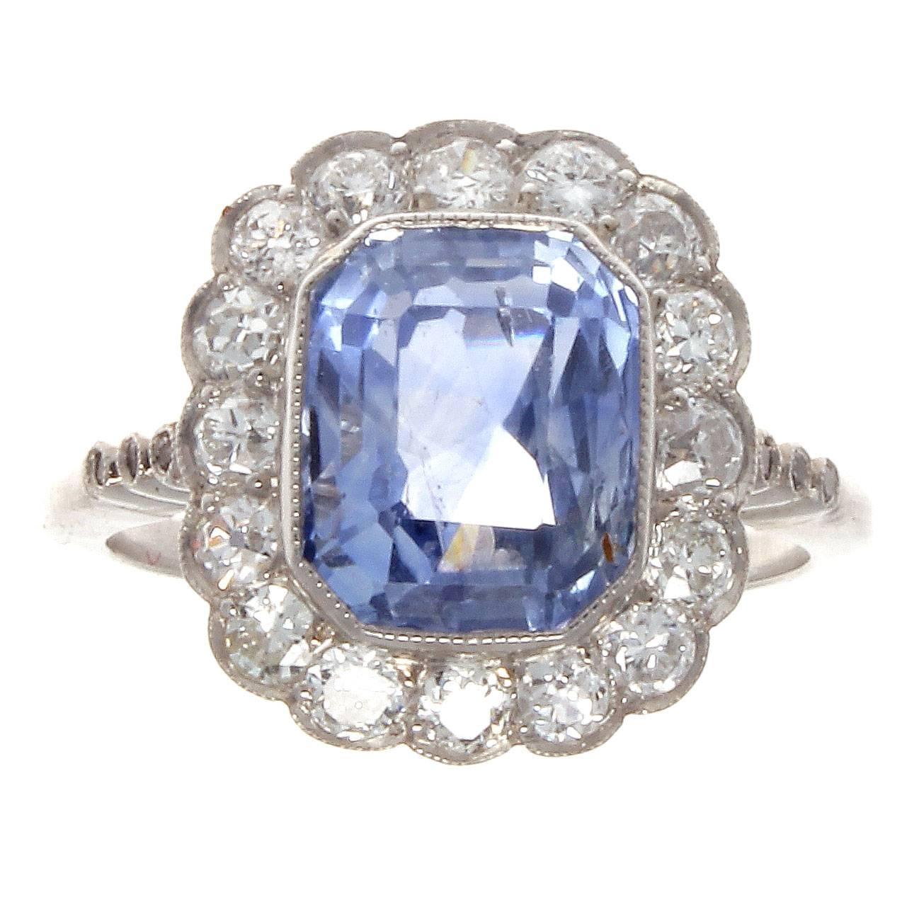 The forever in style halo ring dating all the way back to the early 1800's. Featuring a 4.32 carat sapphire that exudes the sought after cornflower blue from the Ceylon region. Surrounded by 16 old European cut diamonds that are F-G color, VS