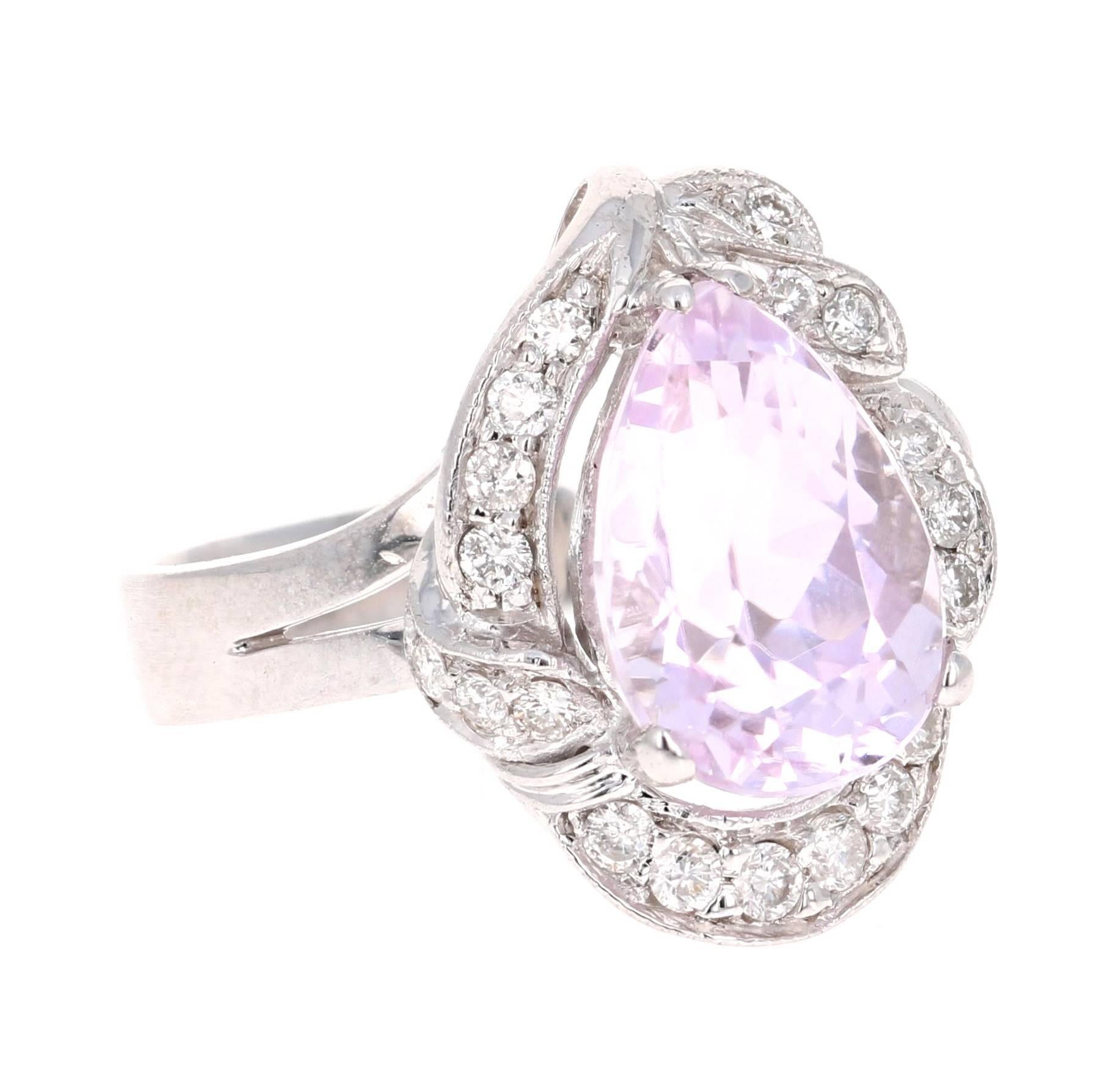 This beautiful piece has a 3.94 carat Pear Cut Kunzite that is set in the center of the ring, it is surrounded by 17 Round Cut Diamonds that weigh 0.38 carats.  The total carat weight of the ring is 4.32 carats. 

The ring is made in 14K White Gold