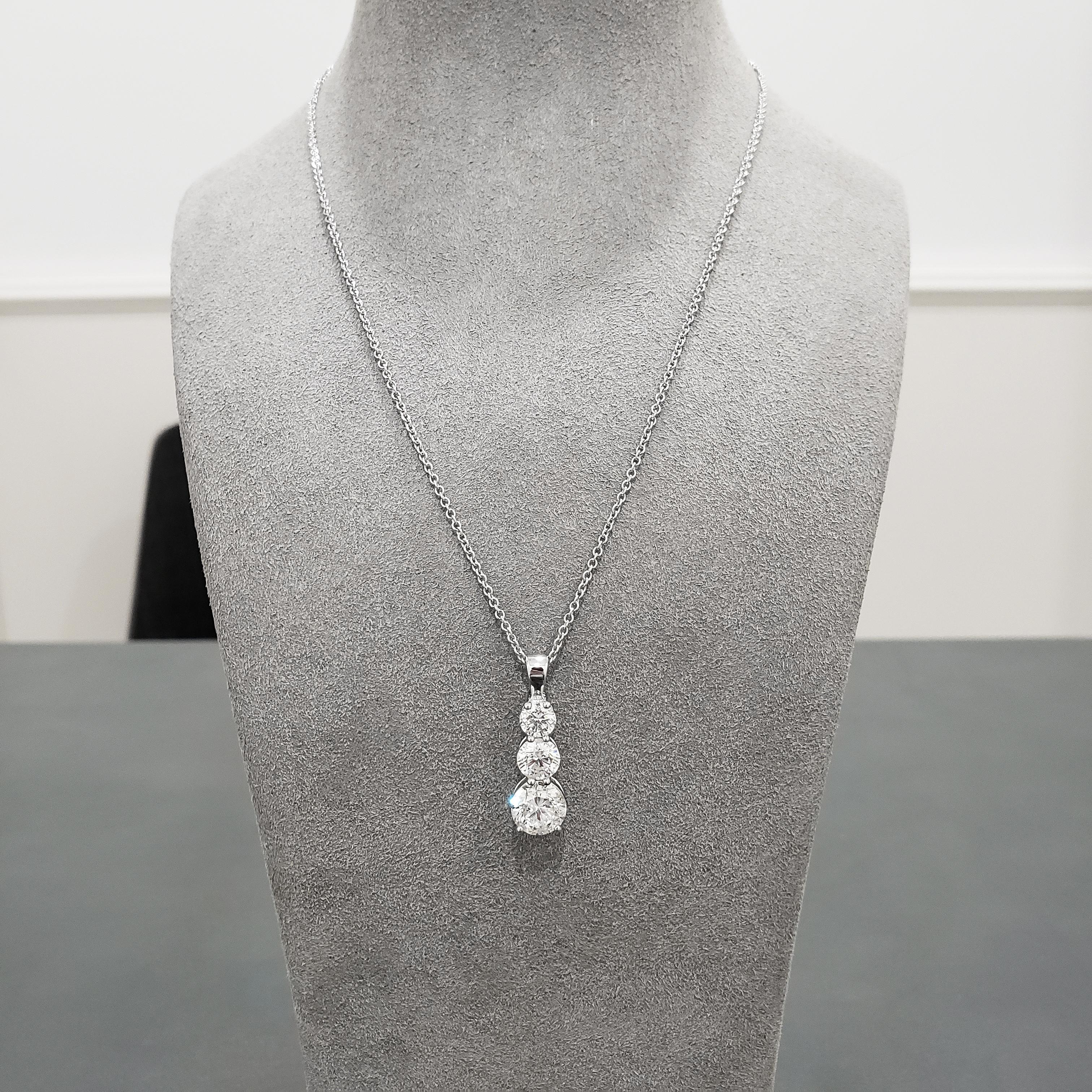 Features three graduating round diamonds set in a brilliant drop setting. Diamonds weigh 2.50 carats, 1.12 carats, 0.70 carats respectively. Suspended on a 18 inch white gold chain. Adjustable 16 - 18 inch white gold chain.

Style available in