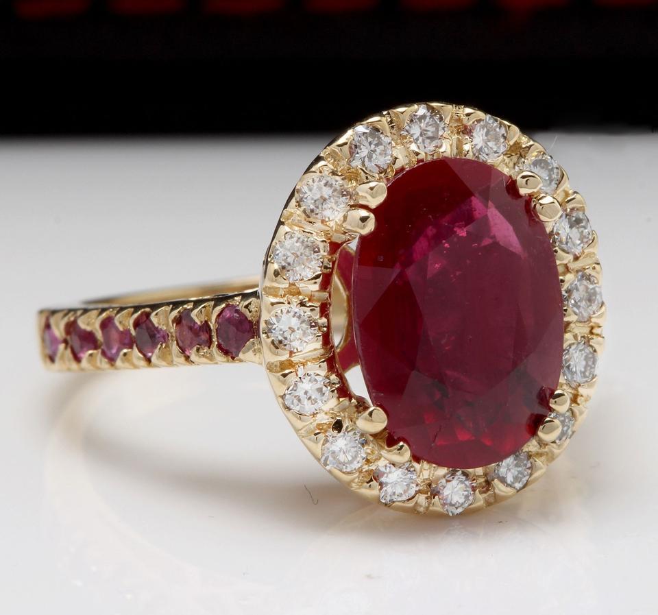 4.32 Carats Gorgeous Natural Red Ruby and Diamond 14K Solid Yellow Gold Ring

Total Natural Oval Cut Red Ruby Weight is: 3.57 Carats

Center Ruby Treatment: Lead Glass Filling

Side Rubies are untreated!

Natural Round Diamonds Weight: .75 Carats