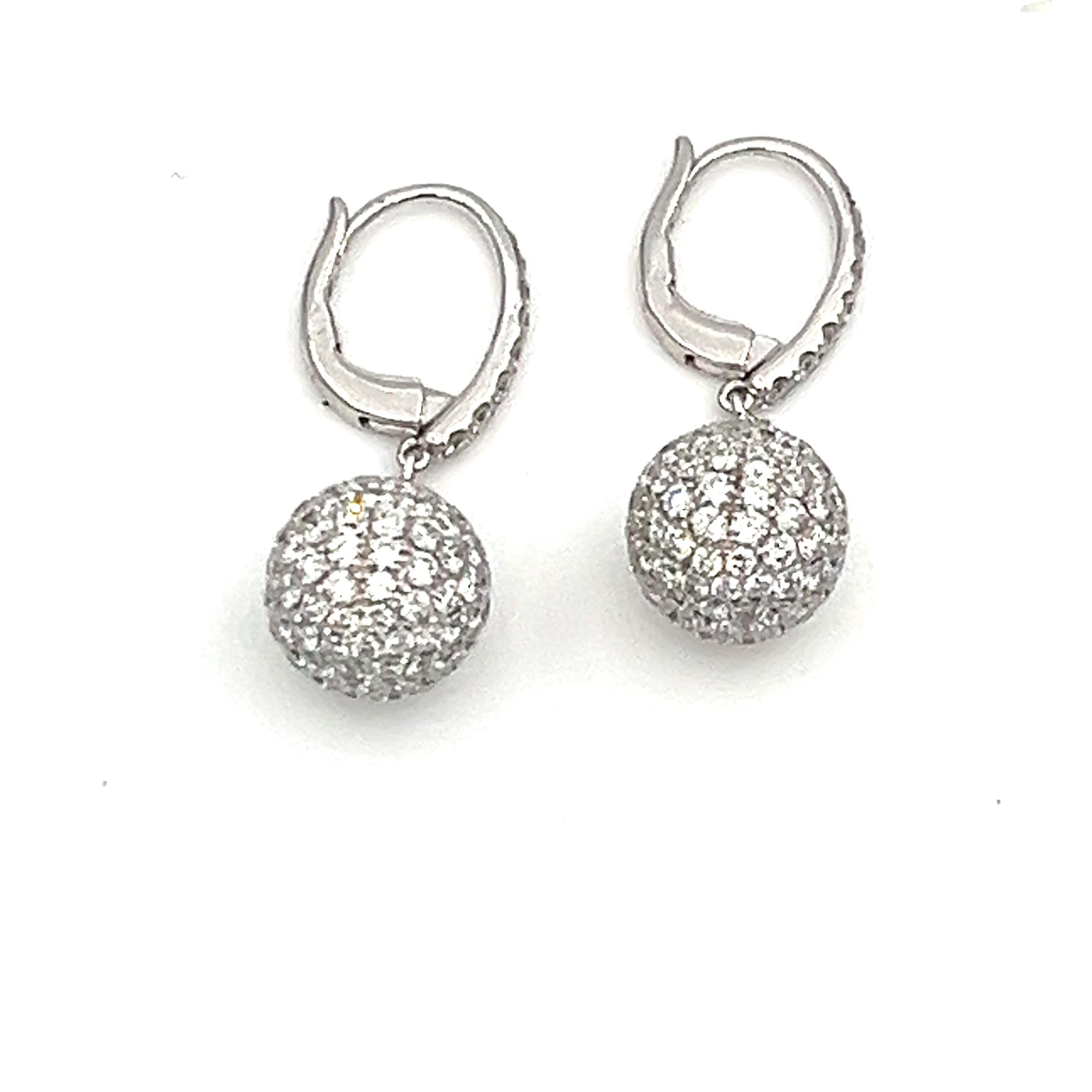 These stunning pave round diamond shape dangle earrings feature 248 diamonds weighing 4.32 carats and graded F/G in color and VS1 in clarity.