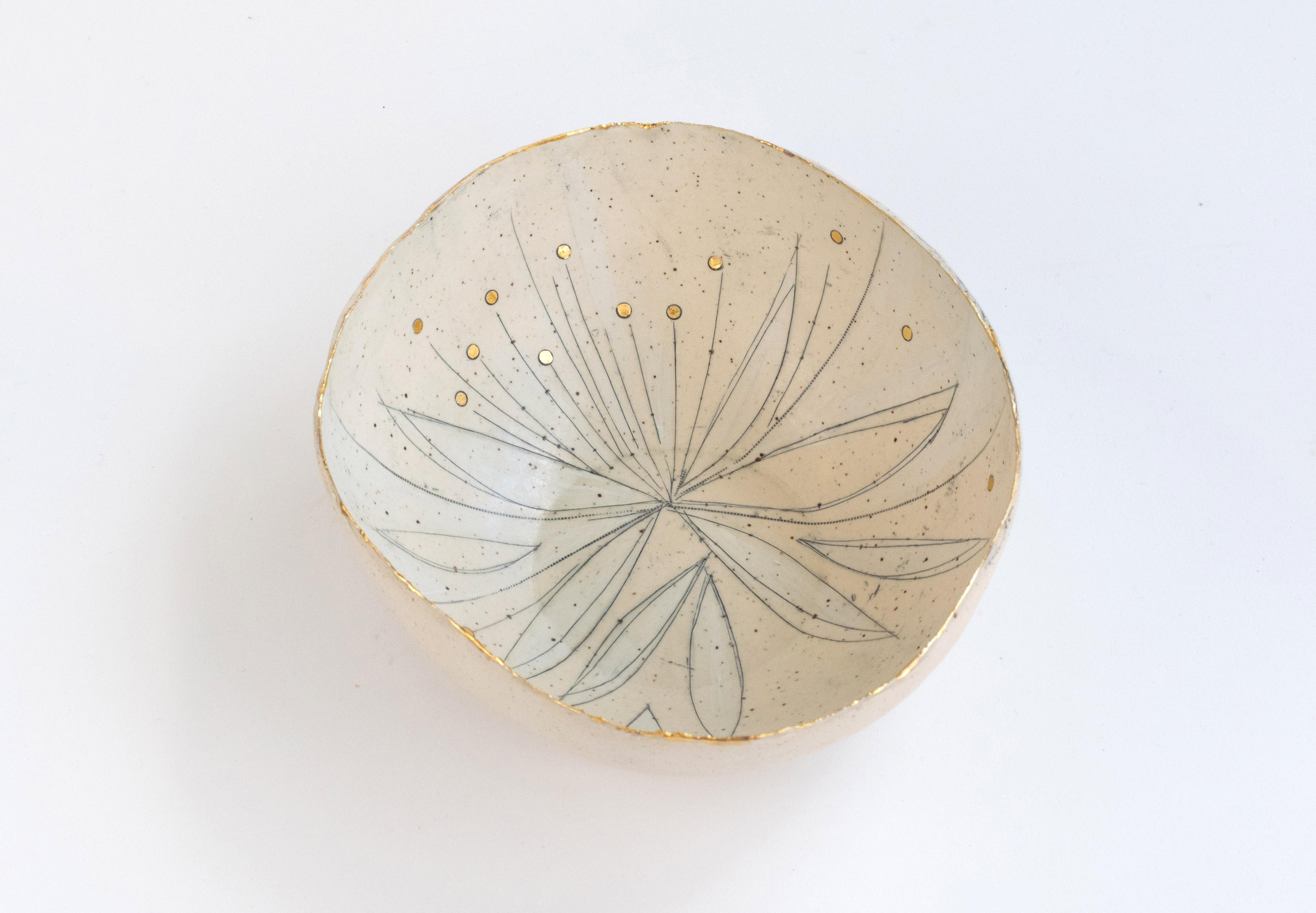 432-G Hand Crafted Golden Springing Stoneware Bowl With 22kt Gold Detail by Helen Prior

A delicate hand-crafted bowl, organic in shape with a torn clay edge in natural speckled stoneware clay.
Part of the Cross Pollination Series - the stylizing