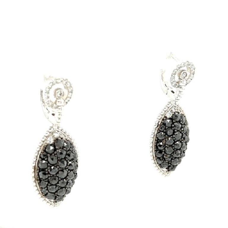 These stunning earrings have Natural Rose Cut Black Diamonds that weigh 3.75 carats and Natural Round Cut Diamonds that weigh 0.58 carats. The Clarity and Color of the Diamonds are SI-F. 

The earrings are curated in 14 Karat White Gold with an