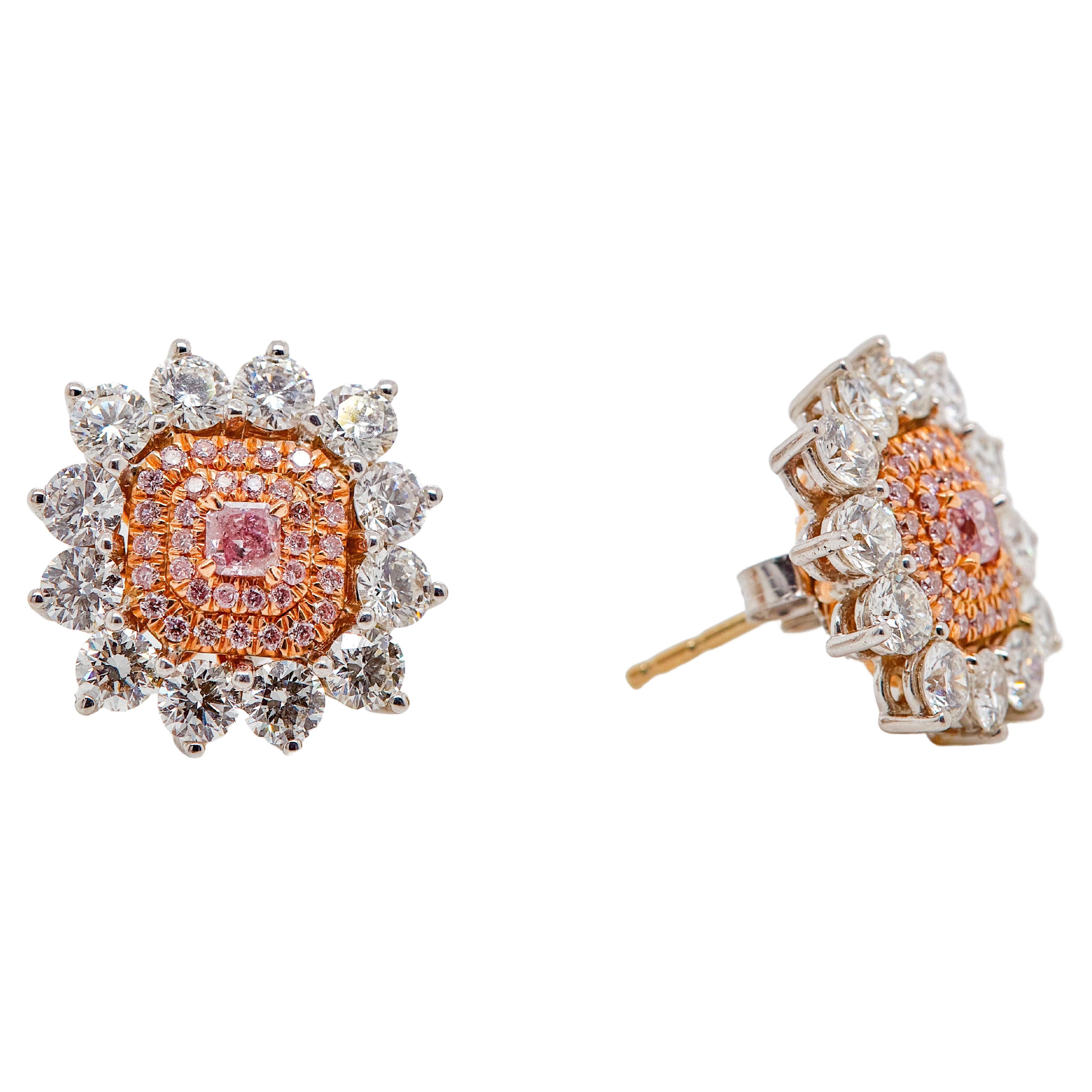 Novel Collection showcasing a pair of 0.31 Carat Fancy Intense Pink Diamond Stud Earrings. GIA Certified as Cut-Cornered Square. Set with 24 round-cut white diamonds totaling in 3.28 carat and 72 Pink diamonds totaling in 0.43 carat. Set in a